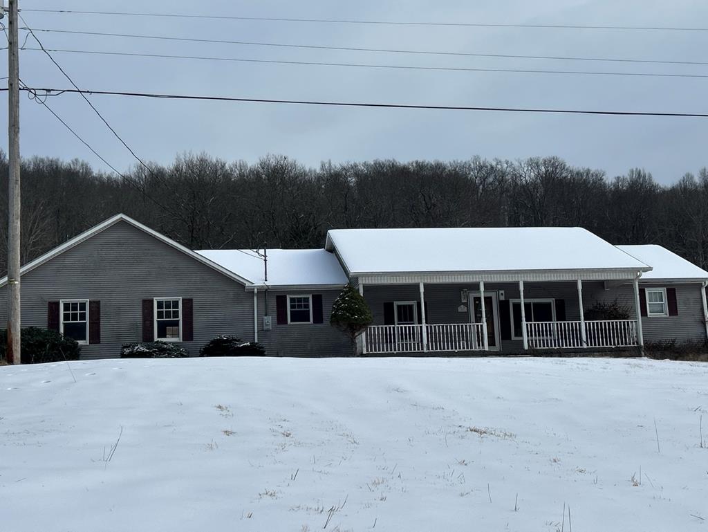 LARGE HOME ON QUIET STREET WAITING ON YOUR PERSONAL TOUCHES.  PROPERTY HAS 7 ACRES, 2 CAR ATTACHED GARAGE AND COVERED PORCH.