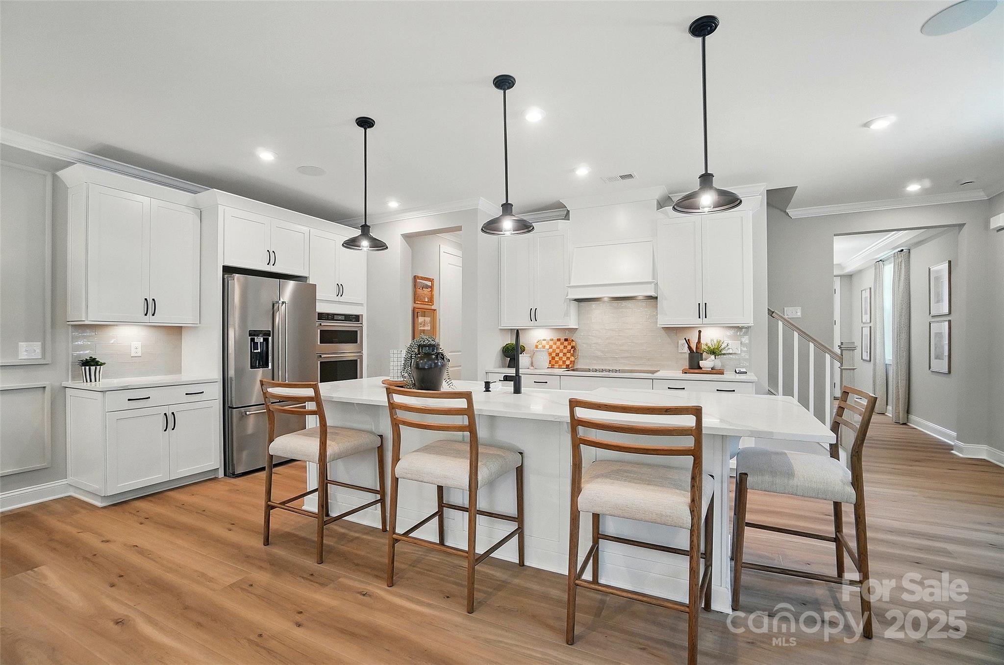 New Luxury Brick townhome in prime Ballantyne residential location!  The Caswell End floor plan is spacious, functional and well appointed. Upon entering, you notice elegant features in the foyer including a Tray Ceiling and ext. Millwork. The large open living area features wide plank flooring, a Gourmet Kitchen with huge island, Kit.Aid appliances, 42" White cabinets w/soft close, pull out shelves,
under cab. lights, Farmhouse sink, and Quartz.  4 bed/3.5 bath including 2 Lg. Primary Suites w/ sitting areas, en suite baths w/ tiled shower, and 2 walk in closets in 2nd floor Primary!  The home is filled with light from an abundance of recessed lights and beautiful trimmed windows.  9 ft. ceilings, 8' doors on 1st and 2nd level, Crown Molding and 2" faux wood blinds throughout the home are a few of the upgrades that enhance this home.

This is one of 17 homes remaining in our boutique community of 28 townhomes.

Ask about financing incentives offered with our preferred lender that lower interest rates and cover closing costs!