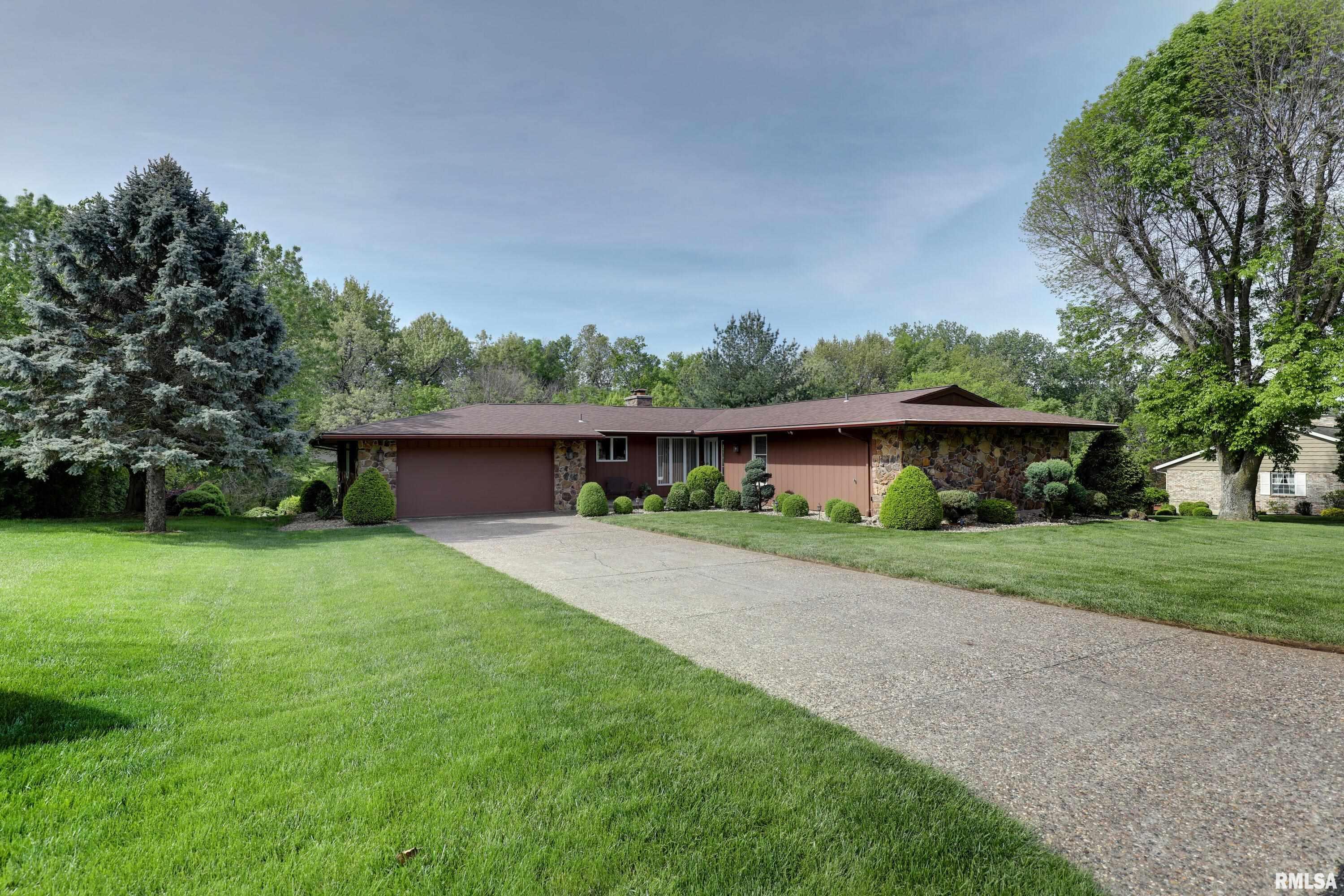 Wonderfully private setting with lots of trees.  Close to Spring Lake and driving range.  Has space in garage for a golf cart. Pool Table in basement can convey.