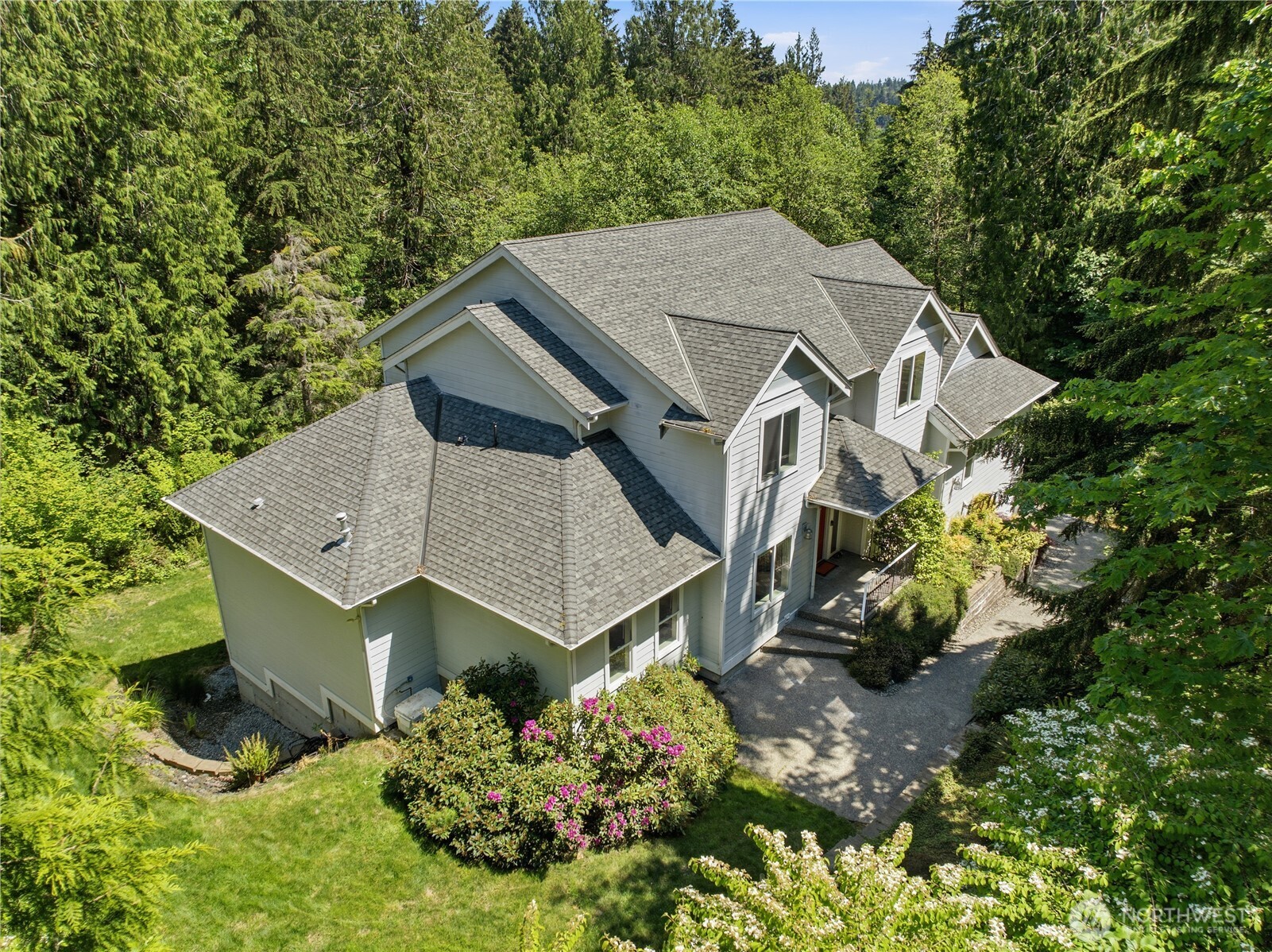Exceptional custom home offering 4,503 sqft of thoughtfully designed living space paired with truly unmatched utility for hobbyists, collectors, or home-based professionals. The standout feature? An extraordinary 1,457 sqft, 6-car garage complete with EV charger—ideal for vehicles, toys, projects, or storage—plus a 940 sqft separate shop with extensive built-ins. Inside, quality craftsmanship shines with Brazilian cherry hardwoods, custom tile floors, slab granite counters, and premium appliances including a Viking refrigerator, Wolf range, and Bosch dishwasher. The spacious kitchen is complemented by a generous walk-in pantry with additional butler’s pantry, while a dumbwaiter adds convenience between levels. The grand main-level primary suite offers a private retreat with jetted tub, walk-in shower, and exceptional walk-in closets. Main level also features a formal dining room; living room; family room with gas fireplace; an office with Murphy bed and built-ins; as well a room ideal for crafts, hobbies, homeschooling, or additional workspace. Upstairs you will find 3 bedrooms with Jack-and-Jill bath and a bonus room with wet bar. Downstairs, discover the theater, a walk-in fire-rated vault (wine cellar?), and half bath. The home is both heated and cooled with an efficient heat pump. A generator is included. This custom-built property is a rare combination of luxury, function, and incredible workspace. (Home is staged & virtually staged).