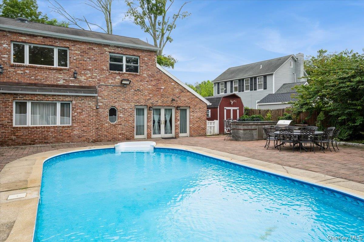Welcome home!  This spacious brick four -bedroom, three-bathroom home with an additional bonus room lives like a five bedroom. With approximately 3,000 square feet of living space it makes this the ideal place to call home.

The first floor primary bedroom features ample closet space, an en-suite bathroom, a sitting area  and a wood burning fireplace. The beautiful, bright white eat-in-kitchen is ideal for casual dining, while the large dining room allows you the space to host grand dinner parties.  The family room has french doors leading out to the beautiful  private back yard that boosts an inground pool, paved patio, amble grilling space and dining area.  The driveway is large and can fit at least 8 cars.

The second floor has three well sized bedrooms and an  additional bonus room.