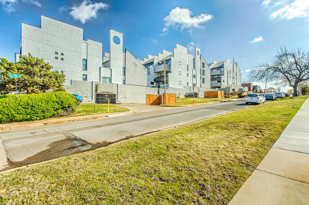 ARCHITECTURAL GEM IN MIDTOWN!Located in OKC’s vibrant Midtown district, this 1984 architectural standout offers a premier footprint in one of the city’s most coveted zip codes. Surrounded by $500K+ new builds, this is a strategic 'buy-in" opportunity for a savvy investor or a homeowner looking to customize their dream loft from the studs up.This specific unit boasts a prime poolside location and features three levels of living space with two private balconies, perfect for enjoying the urban atmosphere. Convenience and security are built-in with lower-level secured designated parking included.The building has recently settled a legal case regarding the roof, with a comprehensive renovation project scheduled to begin in 2026. While the unit currently shows signs of deferred maintenance and water damage, the price reflects its "as-is" condition. This is a rare opportunity for low-cost entry into a neighborhood where property values continue to grow. Bring your contractor and your imagination—the potential here is limitless.