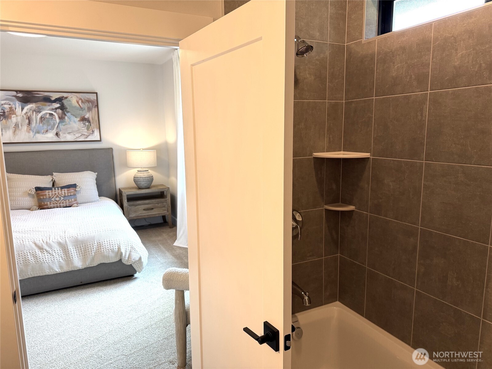 A comfortable second bedroom features its own private en-suite bath,