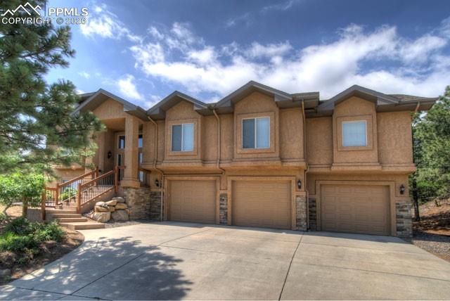 Exclusive location, award-winning school district and peaceful setting.....This magnificent home was built with careful attention to detail, quality craftsmanship, and a sense of what's truly important. The spacious kitchen is perfect for gathering with guests, whether for conversation or cooking together. Beautiful hardwood floors are both attractive and low-maintenance. A sitting area off the kitchen leads to the back patio—great for grilling, enjoying morning coffee, or perhaps spotting some wildlife. The open concept provides a comfortable living area with a fireplace and built-in shelves, perfect for watching Sunday football. Downstairs, the family room—with its own fireplace, sink, and refrigerator—offers a comfortable well-equipped space for kids.  You will find the Primary Suite very pleasing with an attached bath, a small private patio for quiet outdoor time, and a very spacious walk-in closet equipped with built-in bureaus and convenient features for easy living. Laundry facilities are close by.  Additional highlights include more than ample storage, new carpeting installed in 2022, a new furnace and air conditioning system (with ECO thermostat) added in 2024, two hot water heaters replaced in 2023, a Class 4 impact-resistant roof from 2020, humidifier, alarm system, included speakers, a new microwave in 2024, new dishwasher from 2023, and a substantial landscaping upgrade completed in 2024.  The garage features a fantastic work bench, shelving and peg board for your tools. Nothing to do here....Immediate move-in is available. The home is located in the renowned District 12 school system, close to hiking at beautiful Cheyenne Mountain State Park and just minutes from the Broadmoor Hotel.