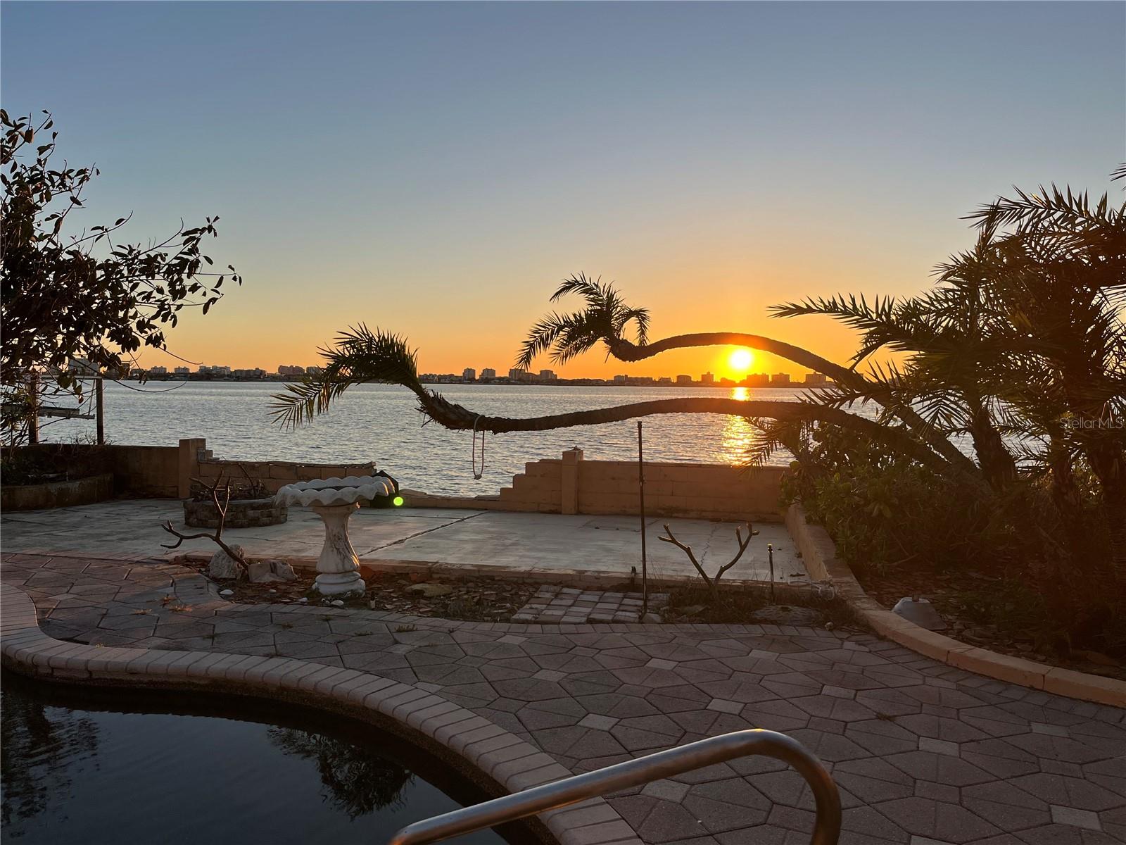 Dream Waterfront Opportunity on the Intracoastal — 130’ of Open Water Views
Welcome to 1844 Venetian Point Drive, a rare waterfront gem nestled on a quiet cul-de-sac in one of Clearwater’s most coveted neighborhoods. This expansive 1.5-lot over one third acre property offers unmatched 130 feet of wide-open Intracoastal frontage, delivering breathtaking west-facing sunsets and panoramic views of Island Estates, Clearwater Beach, and Caladesi Island State Park.

Endless Outdoor Living
Relax poolside, sip cocktails at the two-sided bar in your private cabana or dine al fresco under the gazebo as you watch dolphins and manatees glide by. With multiple outdoor seating areas and lush landscaping, there’s always a perfect spot to soak in the Florida lifestyle — no matter the time of day.

Deep Water Access & Boater’s Paradise
Boating enthusiasts will love the deep-water dock with quick access to the Gulf of Mexico (aka Gulf of America). Cruise the Intracoastal, fish off your dock, or paddle to nearby beaches and islands — it's all just steps away.

Unbeatable Location
Perfectly positioned between Downtown Dunedin and Downtown Clearwater, you’re just minutes from the Pinellas Trail, Honeymoon and Caladesi Islands, Clearwater Beach, golf courses, local restaurants, art festivals, and live music at the new Clearwater Sound Amphitheater.

Ready for Your Vision
The existing 3-bed, 2.5-bath pool home (approx. 2,100 sq ft) experienced water damage during Hurricane Helene and is being sold as-is, creating an exceptional opportunity to rebuild, elevate, or design your custom dream home on one of the largest waterfront lots on Venetian Point Drive.

Don’t miss your chance to own this one-of-a-kind waterfront property in a location that truly has it all — space, views, privacy, and potential.

Measurements are approximate and should be verified.