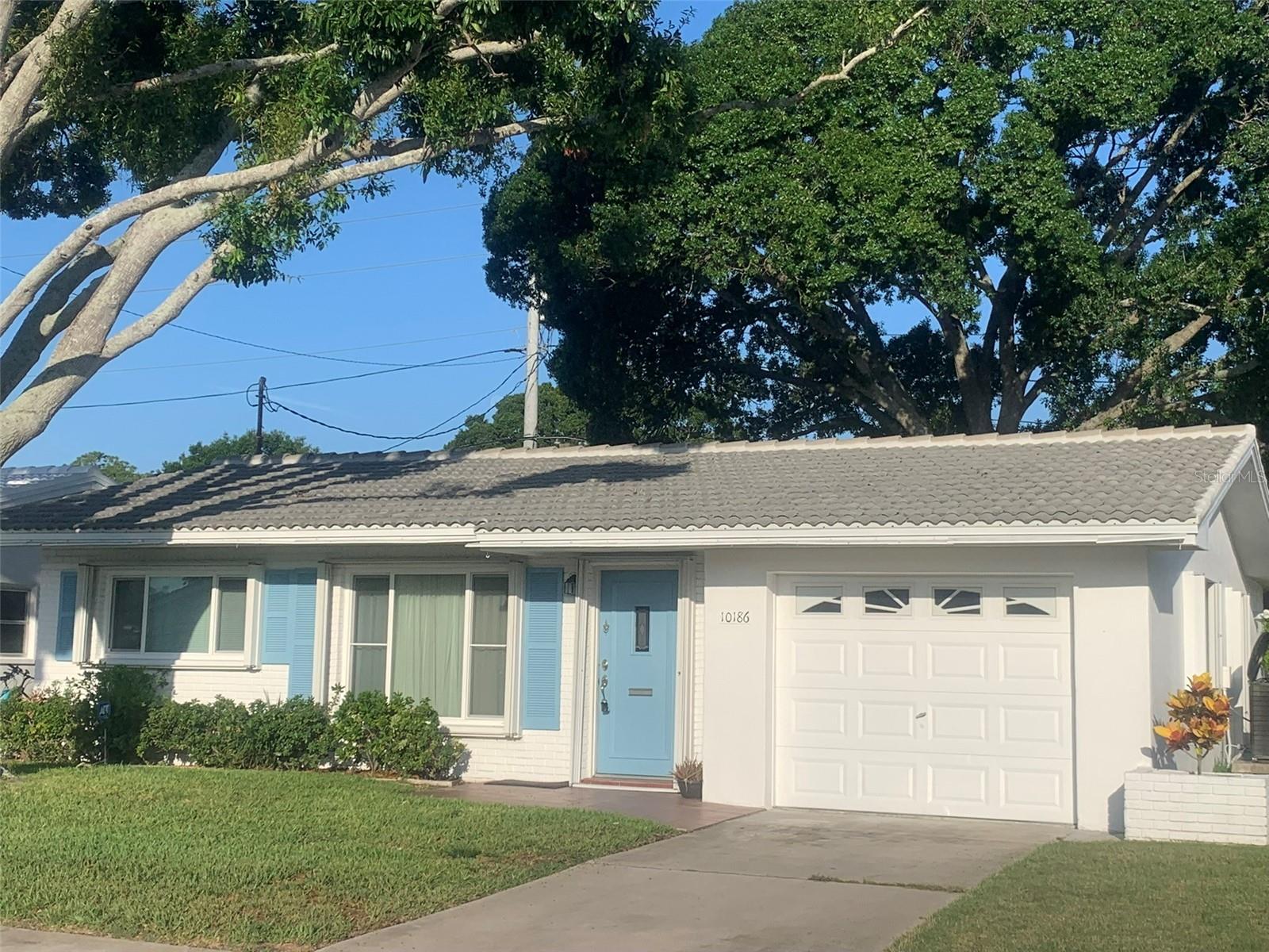 Welcome to this beautifully updated home located in the desirable 55+ community of Mainlands of Tamarac by the Gulf.  Recent improvements include new kitchen with solid wood cabinets, soft close drawers, elegant Quartz countertops and stainless-steel appliances.All new flooring throughout offering upgrade porcelain tile in the living areas and new bedroom carpeting. Fresh interior paint in neutral colors. Both bathrooms feature new vanities, fixtures and commodes. The home has updated windows as well as new roof in 2023. Active clubhouse with heated community pool offers various activities including dances, shuffleboard, golf, card games, bingo, and more. Mainlands is a golf cart community, just minutes away from Freedom Lake Park, that offers dog park, picnic tables, and walking trail.  Ideal central location with proximity to beautiful beaches, 2 airports and shopping.