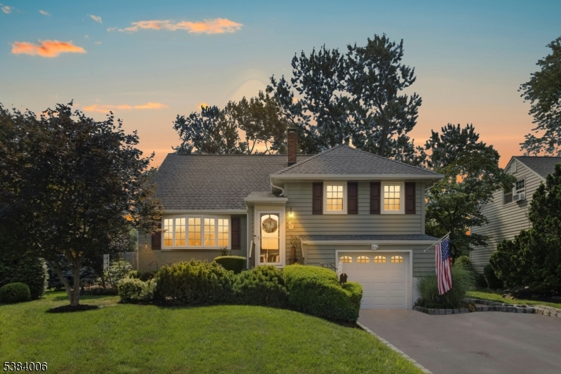 So much to love here with appealing updates throughout! The thoughtfully designed family room is a delight with vaulted ceilings, a stunning floor to ceiling fireplace, a bar, full pantry, custom cabinets, French doors to the backyard and expansive windows with views of cheerful gardens and lush landscaping. The lower level den/office has a woodburning stove, custom built ins and access to both the backyard and garage.  You'll find custom details, warm wood floors, and a flexible floor plan with endless options to suit today's lifestyle. With a welcoming layout the LR, DR, and kitchen have been the heart of many get-togethers and celebrations. There are 3 bedrooms and plenty of options for an at home office, too. An in-law suite can also work in this home. The lower level has a rec room, exercise/media room, game room, laundry room, full bath and lots of storage. Not a flood zone. Hillside Ave School K-8 is less than a block away. Award winning Downtown Cranford restaurants, shopping, cafes, year round community activities are nearby.