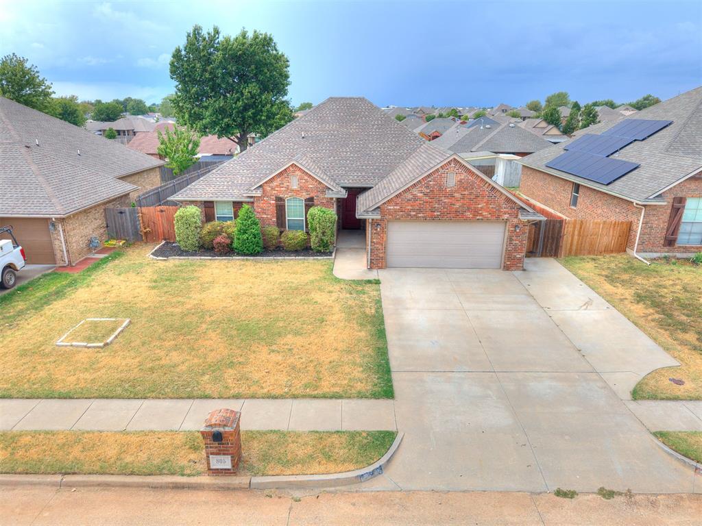 Welcome to this beautifully maintained home in the heart of Moore, offering a fantastic central location with schools, parks, shopping and dining just minutes away! Step inside to a spacious, open floor plan filled with natural light and an oversized entry area with plenty of room to create the perfect drop zone or mud bench. The main living area features built-in bookshelves and a large fireplace with a hearth, creating a warm and inviting focal point for the space. The kitchen offers granite countertops, stainless steel appliances, ample cabinetry and great flow into the living and dining areas, making everyday living and entertaining easy. Luxury vinyl wood flooring runs throughout much of the home, with carpet in the bedrooms and halls. The spacious primary suite is a standout, featuring a beautiful ensuite bathroom with his and hers closets, a large tiled walk-in shower and a relaxing soaker tub. Outside, enjoy the large covered patio with a ceiling fan overlooking the nicely sized backyard, complete with mature landscaping and a storage shed for additional storage. Even better, the home will be getting a NEW ROOF! Located near Moore High School, Highland East Junior High, Apple Creek Elementary and Veterans Memorial Park, this home puts so much of Moore within easy reach. With a great layout, beautiful features and a hard-to-beat location, this one is ready for its next owner!
