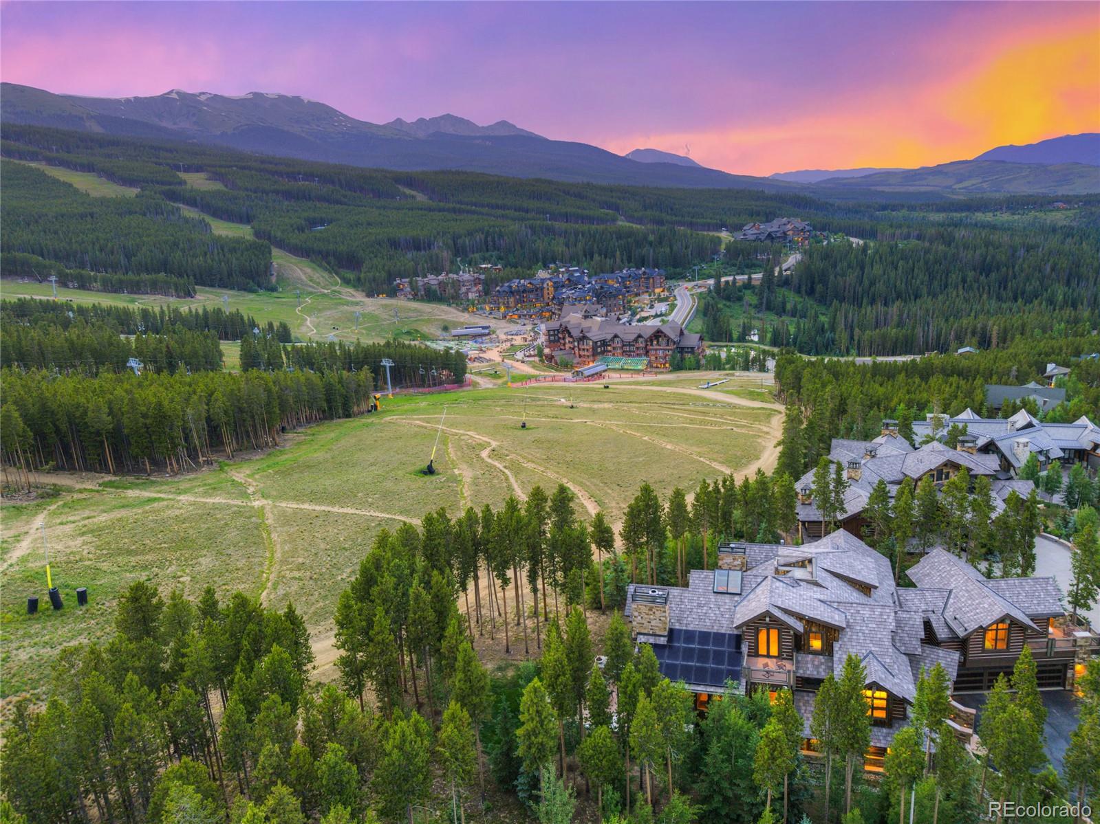 The BEST Ski-In, Ski-Out Home in ALL of Breckenridge—and One of the TOP True Ski Homes in Colorado! This is your chance to own one of ONLY 5 REAL slope-side, ski-in, ski-out homes with direct access to the main ski slope leading straight to the base of Peak 8. 422 Timber Trail backs RIGHT onto Trygve’s run, offering the absolute closest, most convenient ski access of any single-family home in Breckenridge. Imagine stepping out your back door and skiing straight to the lift—no shuttles, no walking, just pure mountain convenience.

This is the FRONT ROW beach property of the mountains—you simply cannot get any closer to the slopes or to all that Breck has to offer, including private access to the world-class amenities at One Ski Hill Place. Whether you’re chasing powder or soaking in après-ski luxury, this is the place.

A true legacy property, this home features 8 bedrooms, 9 bathrooms, and a sprawling, entertainer-friendly floor plan built to host generations of family and friends. Multiple living areas, expansive decks, and an oversized 3-car garage give you all the space and storage you need for every mountain season.

Inside, you’ll be wowed by bold architectural details like a glass elevator, a massive 3-story natural stone wall, and huge view-framing windows. The panoramic views stretch from Baldy Mountain to the entire Ten Mile Range—including Peak 8 and the Imperial Lift, right in your main view corridor. The natural light, luxury finishes, & location make this an elite-level mountain compound.

Best of all—422 Timber Trail is in ZONE 1, allowing unrestricted short-term rentals. That means ZERO restrictions and HUGE income potential. Wake up steps from the lift, catch first chair, and offer guests a true five-star experience with resort-style amenities including a huge mudroom, wet steam room, 14-person hot tub, game room, gas fire pit, and a top-tier chef’s kitchen.

By far the MOST exclusive SKI in SKI out Home in all of Breck...A very rare gem!