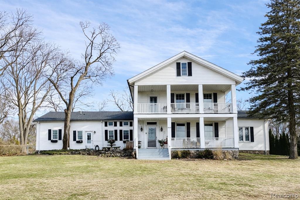 A one-of-a-kind home that blends timeless character with beautiful modern updates. Built in 1920 and offering over 4,500 square feet, this extraordinary residence is set on nearly half an acre of fully fenced land with picturesque lake views. The home features 4 bedrooms and 2.5 bathrooms, including a spacious primary bedroom with a gas fireplace, an oversized walk-in closet, and plumbing in place for a future primary bath. One additional bedroom includes its own private full bath, making it ideal for guests or multigenerational living. The remodeled chef’s kitchen showcases Thermador appliances, a large island, and an expansive eat-in area, all open to the family room for effortless entertaining. The family room offers two door walls that lead to the gorgeous backyard, deck, and built-in heated saltwater pool, creating a seamless indoor-outdoor living experience. A generous 29 x 18 first-floor study or flex room includes a second small kitchen and plumbing, offering excellent potential for a first-floor primary suite or in-law arrangement. Formal living and dining rooms each feature natural fireplaces, adding to the home’s classic charm. Two separate staircases lead to the second floor, which includes convenient second-floor laundry and an expansive 24 x 17 storage room. Enjoy beach privileges through the Randgate Park Association, providing access to all-sports private Elizabeth Lake for only $200 per year. Additional highlights include a two-car detached garage, a two-story attached carriage house with pool equipment and storage, a new roof (2017), an owned water softener, and a Michigan basement. The basement foundation has been inspected by a professional foundation company and confirmed to be sound; please see the report included in the documents. Located within the Waterford School District, this is a rare opportunity to own a truly unique home. BATAVI.