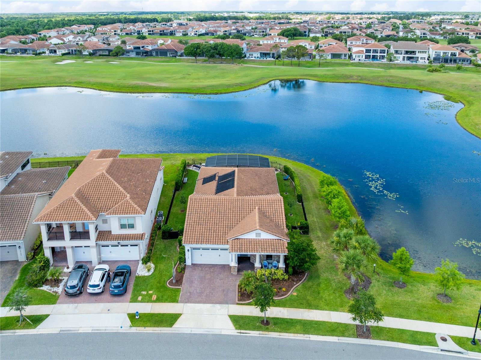 Set on a premier corner homesite in Eagle Creek, this 2021 single-story residence pairs a polished interior with a private screened pool, wide water views, and a thoughtfully separated 4-bedroom, 3-bath layout. With 2,267 heated square feet and 3,106 total square feet, the home is designed around natural light, open gathering spaces, and a strong connection to outdoor living.A defined foyer introduces the home and leads into the main living areas, where high ceilings, crown molding, ceramic tile flooring, and clean sightlines create an elevated first impression. Just off the entry, a refined built-in dry bar adds a custom touch with wood cabinetry, stone counters, floating display shelves, and a textured tile backdrop. The kitchen sits at the center of the home with solid wood cabinetry, stone counters, a large island with seating, pendant lighting, stainless steel appliances, a built-in oven, cooktop, range hood, and a walk-in pantry. From there, the dining and living areas flow together along the rear of the home, with large windows and sliding glass doors drawing in views of the pool, water, and surrounding green space.The floor plan offers a strong sense of privacy without feeling closed off. The primary suite is privately positioned toward the rear of the home near the outdoor living area and includes generous bedroom proportions, a spacious bath, and a large primary closet. The secondary bedrooms are split across the home, giving each area its own sense of separation. One bedroom sits near the primary side of the plan with a nearby full bath, while two additional bedrooms are positioned closer to the front and garage side of the home with another full bath nearby. A dedicated laundry room and attached 2-car garage add everyday function, while details such as ceiling fans, window treatments, built-in features, and thoughtful storage support the home’s clean, practical flow.Outdoor living is the defining feature. The screened pool and patio area stretches across the rear of the home, finished with a paver deck and framed by expansive water and green-space views. The corner lot enhances the sense of openness, while the pool setting creates a private, resort-style backdrop for dining, relaxing, and year-round enjoyment.Eagle Creek offers a guard-gated Lake Nona setting anchored by Eagle Creek Golf Club, with an 18-hole championship course, clubhouse, pro shop, restaurant, and practice facilities. Residents also enjoy a recreation clubhouse, fitness center, resort-style pool, splash zone, tennis and basketball courts, playground, dog park, and open green spaces. Minutes from Lake Nona Town Center, Medical City, Orlando International Airport, major highways, dining, and recreation, this established golf community places everyday convenience and resort-style amenities close to home. Schedule your private showing today.