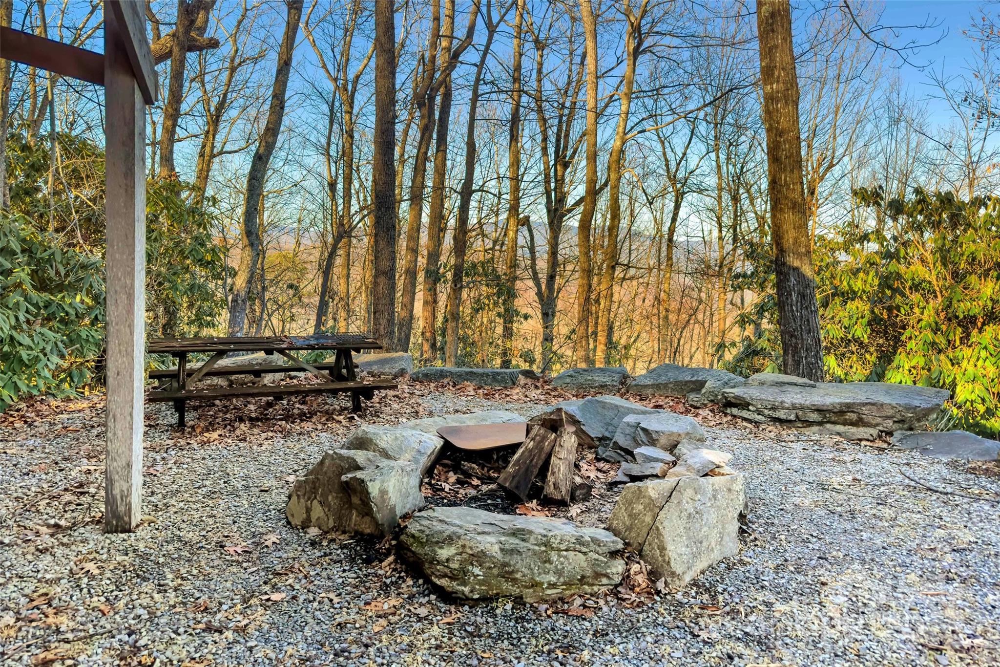 Discover 252 acres of unrestricted land in Western North Carolina, spanning Buncombe and McDowell counties. This exceptional property offers breathtaking long-range, year-round views, lush forests and springs. A private road is already in place, along with electrical infrastructure, providing a strong foundation for your vision. Whether you're dreaming of a private retreat, a sprawling estate, or a development opportunity, this property delivers endless potential. The wooded areas offer a variety of timber and creates a haven for wildlife, making it ideal for outdoor enthusiasts. Many natural resources are on this mountain from minerals to water. With no restrictions, you have the freedom to bring your plans to life—build cabins, create a community, or establish your own sanctuary. Conveniently located near Asheville, Black Mountain, and Old Fort, this rare large tract combines natural beauty, privacy, and accessibility in the heart of the Blue Ridge Mountains. Photos done post Helene