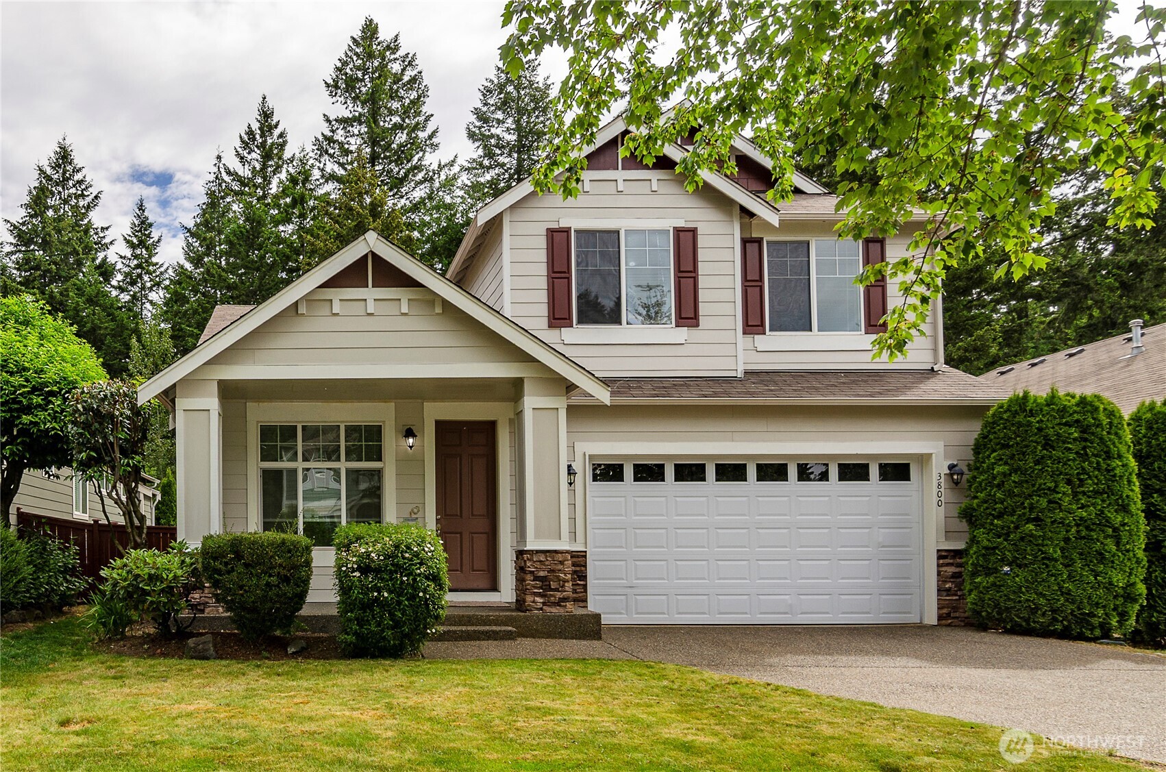 Move-in ready and beautifully maintained, this desirable Campus Glen home offers 3 bedrooms, 2.5 baths, and a contemporary design in a peaceful setting. Fresh interior paint and brand-new carpet create a true turnkey opportunity. The open-concept floor plan features a spacious kitchen with granite countertops, eating island, abundant cabinetry, and a walk-in pantry. The kitchen flows seamlessly into the inviting living room with a cozy gas fireplace, while the front den provides flexible space for a home office, study, or sitting room. Upstairs, the primary suite boasts vaulted ceilings, a large walk-in closet, and an ensuite bath with double sinks and a relaxing garden soaking tub. Two additional bedrooms share a full hall bath, and the landing includes a convenient nook ideal for a workspace or reading area. Located near a cul-de-sac on a dead-end street, this home enjoys added privacy with no homes behind—just wooded green space. Walking trails, parks, and the local middle school are all within easy walking distance. Combining modern comfort, thoughtful updates, and an exceptional location, this move-in ready home is ready for its next owner.  Close to I-5, shopping and JBLM.