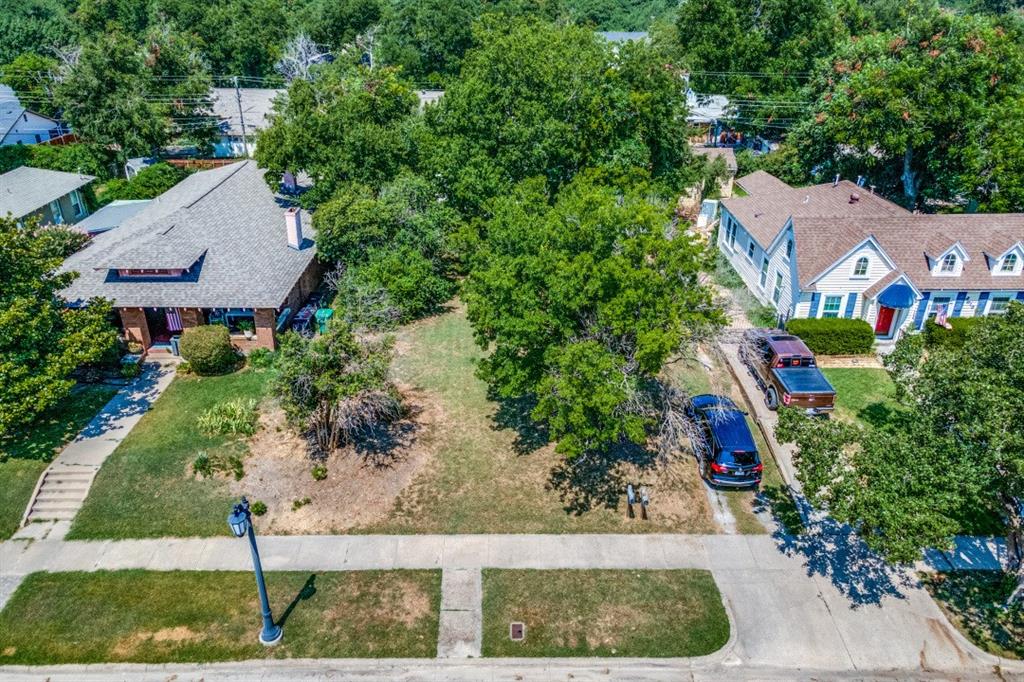 This mid-century ranch-style house plan is a new build opportunity on an oversized lot in the desirable historic Ryan Place neighborhood.  The split-level design takes advantage of the natural slope of the lot as well as provides sensitivity to surrounding architecture.  
Combining excellent light and a modern flow, this house has been thoughtfully arranged into three levels. Off the entry on the main level are the primary suite, office or guest or nursery suite as well as the laundry room.  The living room, kitchen, dining room and half bath are located on the lower level.  Three additional bedrooms along with two full bathrooms and a large play room are located on the top level which has an open railing loft-style concept.  For backyard access, the plan includes french patio doors and sliding glass pocket doors that seamlessly merge the interior with the exterior living, dining and kitchen areas which are covered by roof and protected with motorized screens.   A pergola-covered garden with a water feature provides a relaxing and inviting focal point for the lower level and backyard. Builder can provide alternative custom home designs for this property.