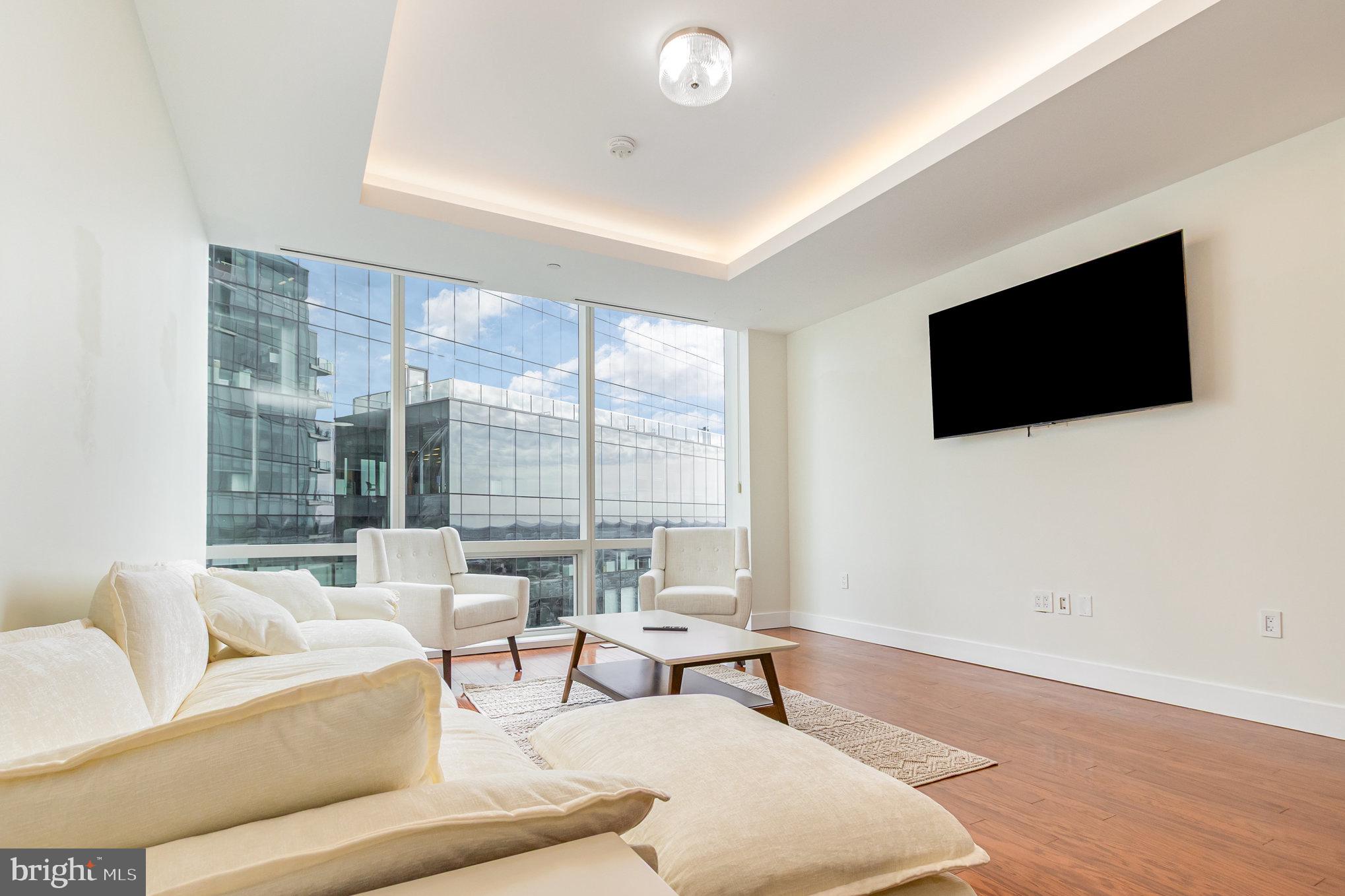 Welcome to the Four Seasons Private Residences in the heart of Harbor East, where luxury, location, and lifestyle converge.  From the 21st floor, this gorgeous 1 bedroom, 1.5-bathroom residence offers spectacular  views of the Inner Harbor and marina and the Baltimore city skyline through  floor-to-ceiling windows.  This refined residence features rich cherry flooring and high-end finishes throughout. The gourmet kitchen is outfitted with elegant cabinetry, a gas cooktop, wall oven, huge island with breakfast bar, and elegant quartz countertops. The adjacent dining area and wet bar with sink and wine fridge are ideal for entertaining or for a quiet night at home.  The primary suite includes a custom walk-in closet and a luxurious marble bathroom with double sinks, a large soaking tub, and separate shower. A second room, also nicely sized, offers comfort and privacy for guests or family.  As a resident, you’ll have exclusive access to the private 28th-floor amenity level featuring an indoor saltwater infinity pool, sauna, outdoor deck, fitness center, meeting rooms, and lounging areas — plus a dog-walking area for your furry family members.  You’ll also enjoy full access to all hotel amenities, including the outdoor pool and valet services. The Four Seasons features four on-site restaurants, and many amazing dining options just a short walk away in Harbor East and Fells Point.  Shopping, parks, harbor activities, museums, and miles scenic waterfront walkways are all close enough to enjoy every day.  Experience luxury living at the Four Seasons, it’s more than a residence, it’s a lifestyle.