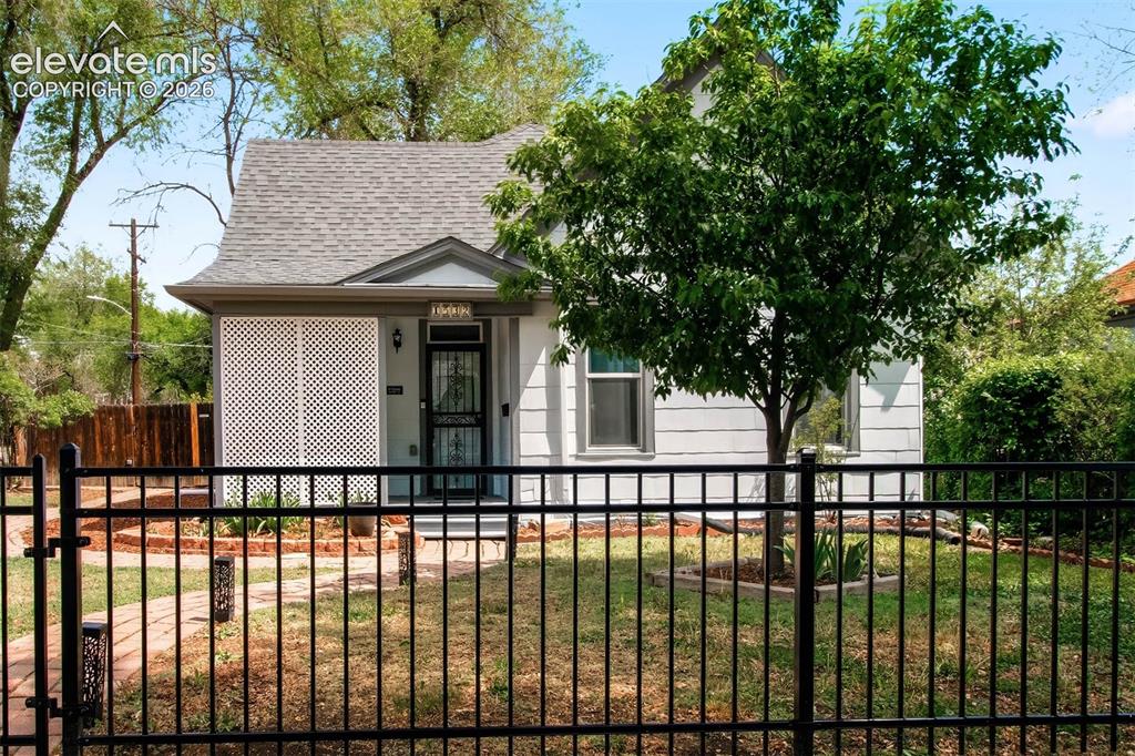WELCOME HOME! Step into a rare blend of history, charm, and thoughtful modern living in this beautifully preserved 1889 ranch home. From the moment you arrive, you feel the kind of warmth and character that simply can’t be recreated. Imagine slow, cozy mornings on the inviting front porch, coffee in hand, taking in the peaceful surroundings. Inside, soaring vaulted ceilings elevate the space, while fresh interior paint and abundant natural light create an inviting, airy feel. The kitchen has been tastefully updated with refreshed counters and lower cabinetry, complemented by stainless steel appliances, including a gas stove—perfect for everyday living and entertaining. With 3 refreshed bedrooms and a fully remodeled bathroom, every space has been thoughtfully designed for comfort and function. The basement offers additional flexibility—ideal for storage, hobbies, or a space that adapts to your lifestyle. Behind the charm is an impressive list of upgrades that bring peace of mind: smart lights & thermostat, new carpet, updated ceilings, improved airflow w/added cold air returns, newer furnace & A/C, dehumidifier, sump pump, water heater, PEX plumbing, replaced sewer and water lines, blown attic insulation, seamless gutters, newer roof & underlayment, new fencing & a hot water recirculation pump ensuring efficiency for years to come. Outside is where this property truly shines. Situated on an oversized, meticulously maintained lot, you’ll find a private backyard retreat designed to be enjoyed in every season. A pergola-covered patio, spacious deck, solar lights, raised garden beds, greenhouse, and large shed create endless opportunities for relaxing, gardening, or gathering. Alley access leads to the detached 2-car garage for added convenience. Fresh exterior paint across all structures ties everything together, while stunning mountain views provide the perfect Colorado backdrop. This is more than a home. It’s a lifestyle rooted in character, comfort, and connection.