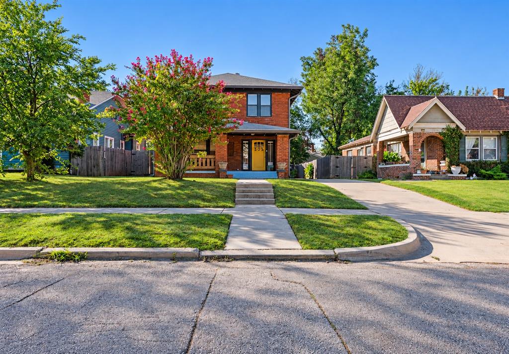 Welcome to this beautifully updated two-story brick home in the heart of Oklahoma City! Ideally located just minutes from Downtown OKC, Midtown, the OU Health campus, the Paseo Arts District, and the Plaza District, this home offers the perfect combination of historic charm, modern updates, and convenience. Step inside to discover gorgeous hardwood floors, abundant natural light, and a spacious living room featuring a charming fireplace with built-in shelving. The updated kitchen boasts granite countertops, stainless steel appliances, white cabinetry, and a center island, while the adjoining dining area is perfect for everyday living and entertaining. Upstairs, you'll find three bedrooms, two full bathrooms with beautifully tiled showers, and a versatile open area ideal for a home office, playroom, or additional sitting space. A convenient half bathroom is located downstairs. Large windows throughout the home create a bright and inviting atmosphere, while tasteful finishes and modern lighting add to its appeal. Outside, enjoy a fenced backyard, generous concrete parking area, and a spacious detached two-car garage. With a neighborhood park and playground nearby, this move-in-ready home offers an exceptional opportunity to enjoy all that central Oklahoma City has to offer. Buyers to verify all the school information.