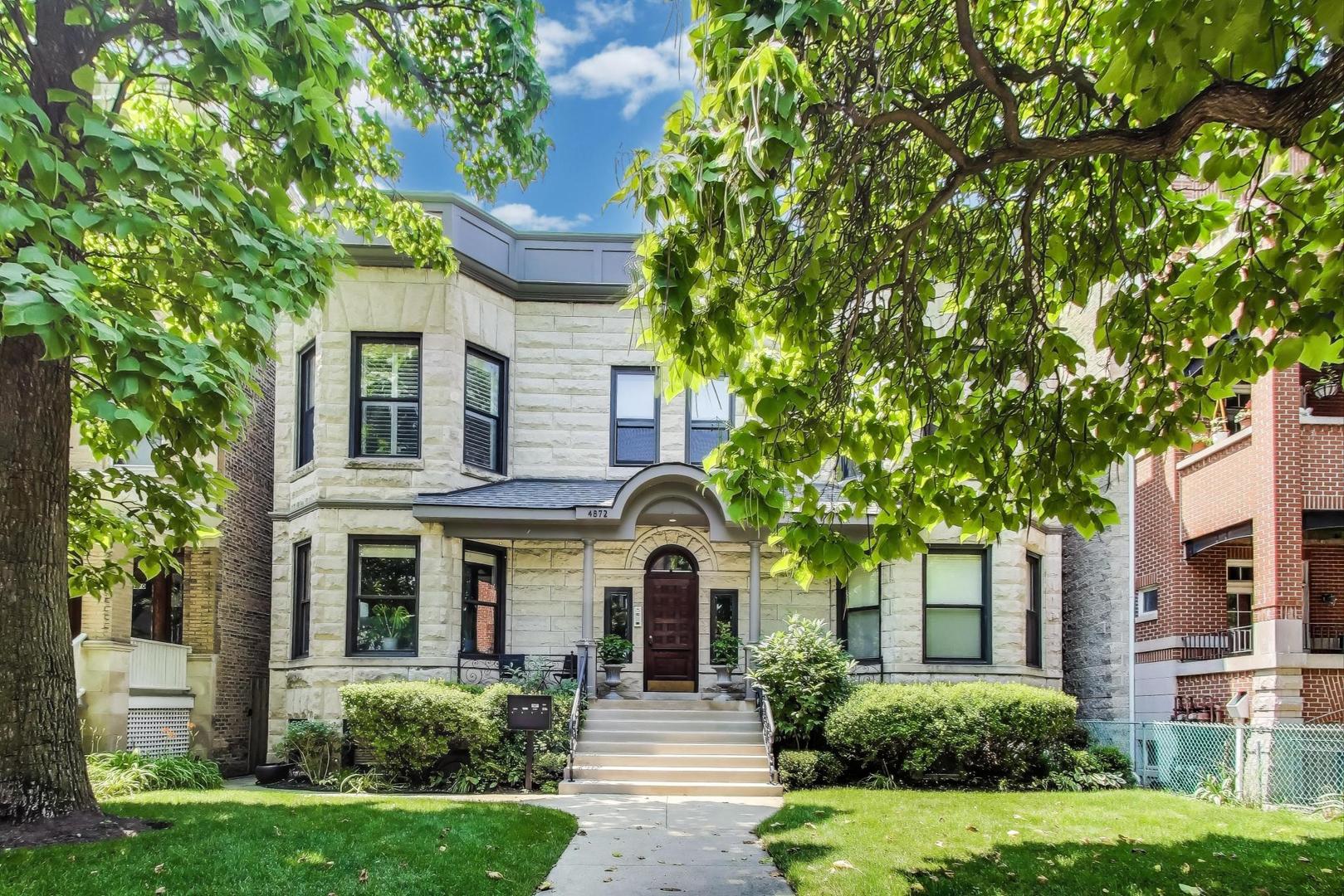 Two spectacular levels with nearly 2800 sf include garage + parking + large private terrace + roof rights + enormous extra storage.   * * *    This 1891 Greystone sits on a lushly landscaped 50' wide by 165' deep lot on a serene, tree-line Ravenswood street.   Steps to Andersonville, Lincoln Square, Metra, Brown Line, Marianos, local restaurants, shopping & nightlife. * * * Inside, the custom design seamlessly blends original solid-oak doors, fireplace mantel, restored millwork, brass hardware and hinges with top-of-the-line appliances, custom cabinetry and lustrous Italian marble and porcelain. * * * The kitchen's island and shelving are handmade of reclaimed lumber from Chicago Ash trees.  * * *  Custom built-in desk & wine refrig, too.  * * *  Ensuite second bedroom.  * * *  Every closet is brilliantly outfitted, including the 10'x4' walk-in pantry.  * * *  There's a wine closet ready to be stocked; a real laundry room with cabinetry and utility sink; plus gigantic extra storage you won't believe!  * * *  The rear mudroom leads to a large patio overlooking the landscaped yard. * * *  Exceptional workmanship and timeless finishes, throughout. * * *  Intimate 4-home association is meticulously managed.