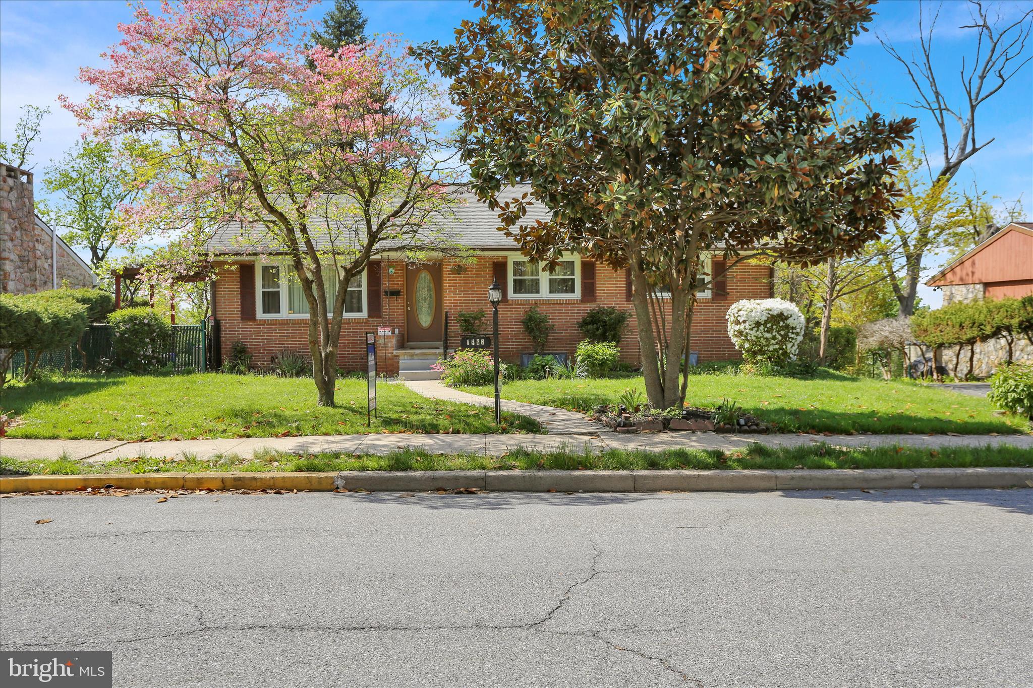 Located in Hampden Heights, this ranch home offers 3 bedrooms and 2 full bathrooms with a functional layout and multiple living spaces. The main level features original hardwood flooring throughout much of the home, along with a spacious living room filled with natural light. The kitchen includes a gas cooktop, double oven, dishwasher, and ample cabinet space, with access to a side entrance highlighted by a pergola.A finished basement with a private entrance provides additional flexible space for a family room, recreation area, bedroom, or home office. Outdoor features include a fenced yard, covered rear wooden deck, and a side pergola area for additional outdoor use. The property also offers gated parking, an attached garage, and a storage shed for lawn and garden equipment. Additional updates include a roof installed in 2018, along with newer water heater, heating system, and central air conditioning. This home will not last long. Schedule a showing today!