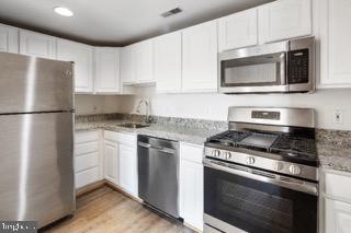 Live in the heart of downtown Baltimore’s historic Fells Point, just steps from the waterfront and a vibrant mix of local shops and restaurants. These spacious one- and two-bedroom apartments offer a rare combination of private outdoor space and classic neighborhood charm.Each unit features a comfortable, open-concept living room and kitchen layout that’s ideal for relaxing or entertaining, along with either a private patio or balcony perfect for taking in beautiful city views. Inside the gated development, residents enjoy added privacy and security while staying closely connected to the energy of Fells Point’s young, bustling community.Outside your door, you’ll find a diverse range of locally owned cafes, boutiques, eateries, and historic sites that celebrate the area’s nautical roots. Whether you’re commuting downtown, exploring the harbor, or enjoying a night out on the cobblestone streets, 724 S Wolfe Street puts you at the center of everything Fells Point has to offer. Enjoy the added convenience of a dedicated parking spot included in the rent—so you can soak up city living without worrying about where to park when you come home.