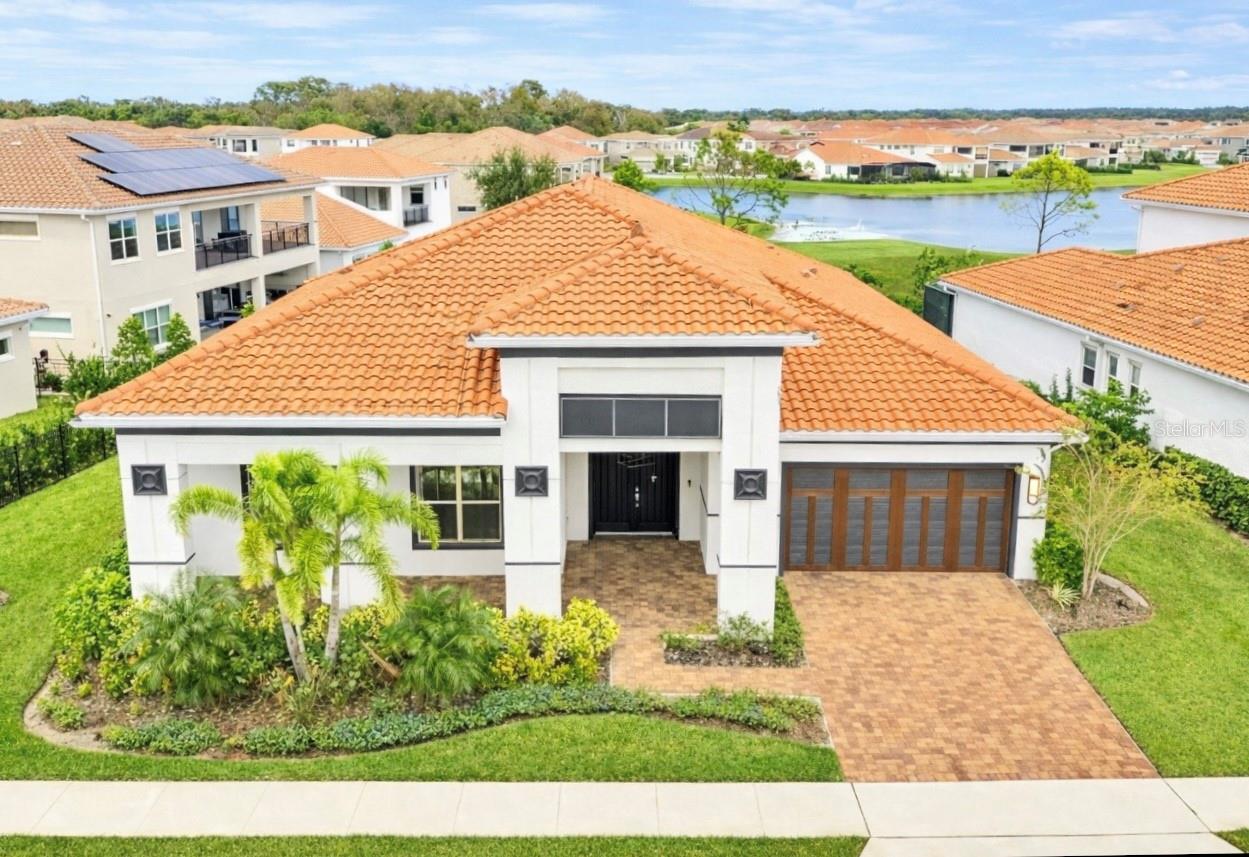 Step into a world of luxury at Eagle Creek, one of Central Florida’s most distinguished golf communities with 24 hour guard gated security!! This elegant residence features four spacious bedrooms, four luxurious bathrooms, and a stunning pool, all perfectly positioned on the breathtaking 14th hole of the Eagle Creek golf course!! Designed with exceptional attention to detail, this home is ideal for anyone wanting to indulge in the vibrant Florida lifestyle!! The chef’s kitchen is a true culinary masterpiece, showcasing sleek light cabinetry, a huge center island, beautiful light quartz countertops, high end stainless steel appliances, an elegant glass wine cellar, and many more upgrades!! For those who love outdoor entertaining, the summer kitchen is ready for you, complete with retractable shades, a propane grill, a refrigerator, and even your own ice maker!! Eagle Creek offers an impressive list of amenities, including a championship golf course, a two story golf clubhouse with a pro shop, a lounge and restaurant, a fitness center, a resort style pool with a kiddie splash area, tennis courts, basketball courts, dog parks, playgrounds, all with NO CDD!! Experience everything the vibrant Lake Nona area has to offer, known for its A rated schools, with the elementary school right inside the community, The Medical City, The USTA Tennis Complex, Lake Nona Performance Club, Boxi Park, and countless restaurants and retailers!! You will also enjoy convenient access to major highways, 417 and 528, just 15 minutes to the Orlando International Airport, 30 minutes to Disney attractions, and less than 30 minutes to the Universal and I Drive area!! This property is the perfect blend of luxury and convenience, set in an unbeatable location that puts all your favorite attractions close by!! All furniture is included as an additional incentive!! The lifestyle of your dreams is waiting for you!! Come see it today!!