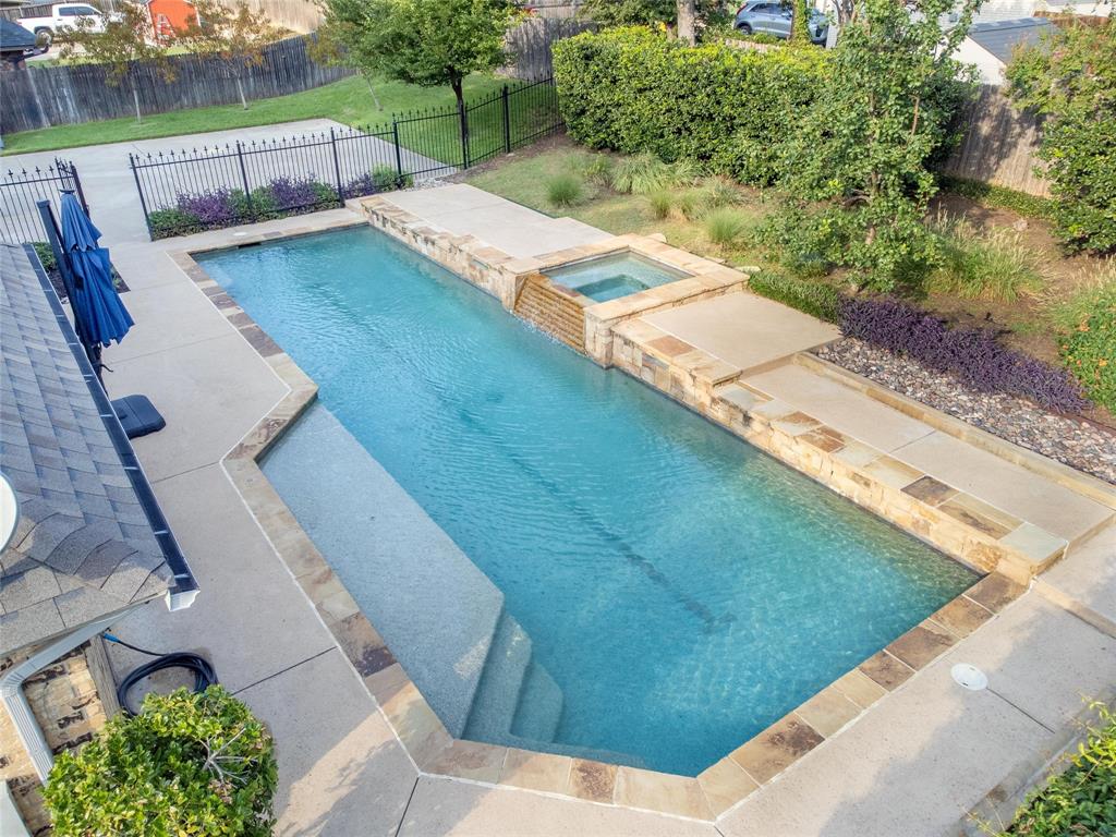 All you have to do is bring your furniture and family. Every surface of this stunning 5-bedroom custom home has been thoughtfully renovated with high-quality materials & exceptional craftsmanship.The less than one year-old roof & HVAC system offer peace of mind, the newer black framed windows offer quaint charm, the 12 foot island and ample gathering space between kitchen and living areas offer an entertainer’s
dream, and the hand scraped hardwood floors offer a rustic luxury that will never grow old. The Old Chicago brick fireplace and kitchen backsplash add timeless warmth & classic comfort to the home you’ll never want to leave. Just beyond the bay-window seat & beautiful French back door, you’ll find a private oasis featuring a Claffey-built lap pool and spa, complete with water features & a chiller for those hot Texas summers. You’ll be surrounded by mature trees, lush landscaping, and a serenity so relaxing you’ll forget about laundry and dinner. Inside, a flexible 2-story layout with abundant natural light, spacious living areas, and 3 completely renovated full bathrooms will make YOUR house the one everyone wants to come to. Located in a gorgeous, established neighborhood known for its LARGE trees and character, this property combines modern updates with timeless appeal. Families will appreciate being part of the sought-after HEB school district and a block away from beautiful Mayfair park with walking trails, a full playground, and pavilion. Commuters will love the central location right between Dallas and Fort Worth, just 10 miles from DFW airport. A whole-home generator means you always have power, ensuring comfort and security in all seasons.This home is one-of-a-kind, rare opportunity to own a fully renovated gem, including brand new stainless steel kitchen appliances and high end washer & dryer, in one of the area’s most desirable communities—where thoughtful updates, classic character, and modern luxury converge to create perfection.