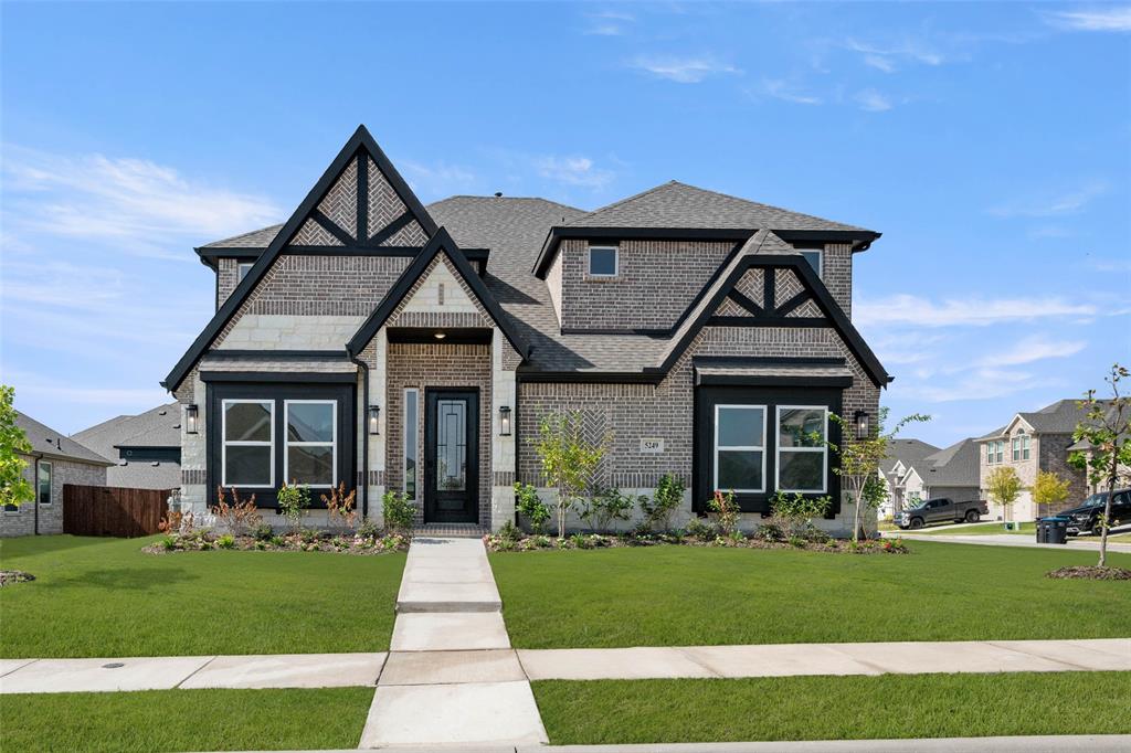 MLS# 20661728 - Built by First Texas Homes - Ready Now! ~ Nestled on a large corner homesite with rear side garage entrance. Lovely street view with an elevation featuring stone, cedar, herringbone brick patterns and steep roof pitches. Built with lifestyle in mind with two bedrooms and two full baths on first floor. Large bedrooms both up and downstairs provide great wall space for furniture placement. Family friendly featuring home theater, game room and oversized patio. Many upgraded features planned for this new home!