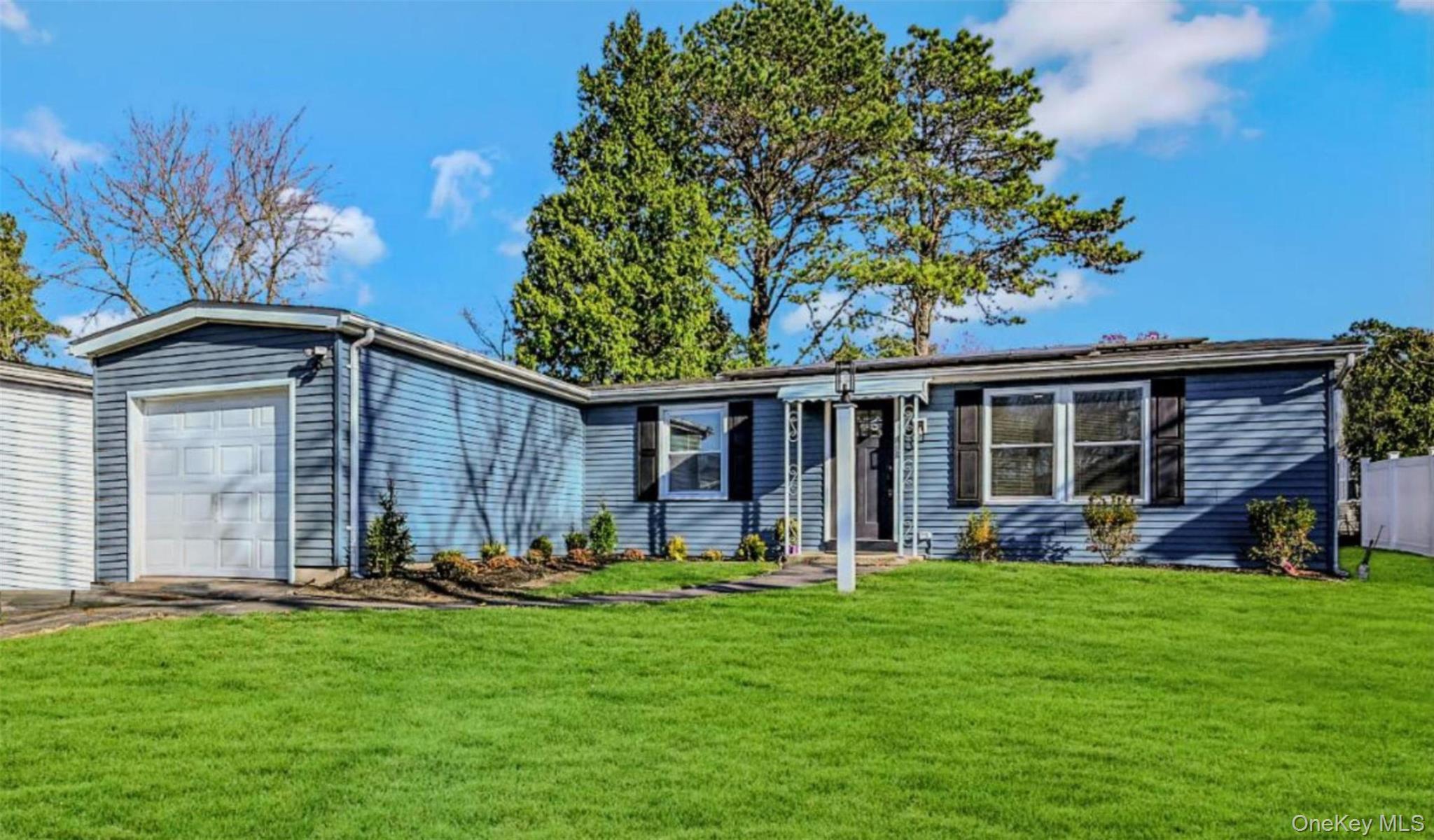 Charming and fully renovated, this one-level ranch is located in the desirable 55+ gated community of Greenwood Village. The open floor plan includes a spacious living room, dining area, sunroom, and a beautifully updated eat-in kitchen featuring new stainless-steel appliances, soft-close cabinetry with pull-out shelves, quartz countertops, and new recessed lighting. Renovations continue throughout with new luxury vinyl flooring, freshly sheetrocked walls and ceilings, new doors and windows, plus a new garage door and roof.   Both bathrooms have been tastefully updated with new tile, flooring, vanities, toilets, and lighting.  The primary bedroom offers a walk-in closet, a second closet, and an en-suite bath with a walk-in shower, while the second bedroom is served by a full bath with a relaxing soaking tub.  Comfort features include new in-wall air conditioners, an existing dual heating/CAC system in the kitchen, and electric baseboard heating with individual room thermostats. Energy-efficient leased solar panels and in-ground sprinklers complete this truly move-in-ready home. Greenwood Village offers a socially active clubhouse, tennis/pickle ball, outdoor pool, gym, bocci, shuffleboard and more. There are many planned activities and even a bus service that takes residents shopping, to houses of worship and to other scheduled destinations. All purchases are cash only and community application approval is required.