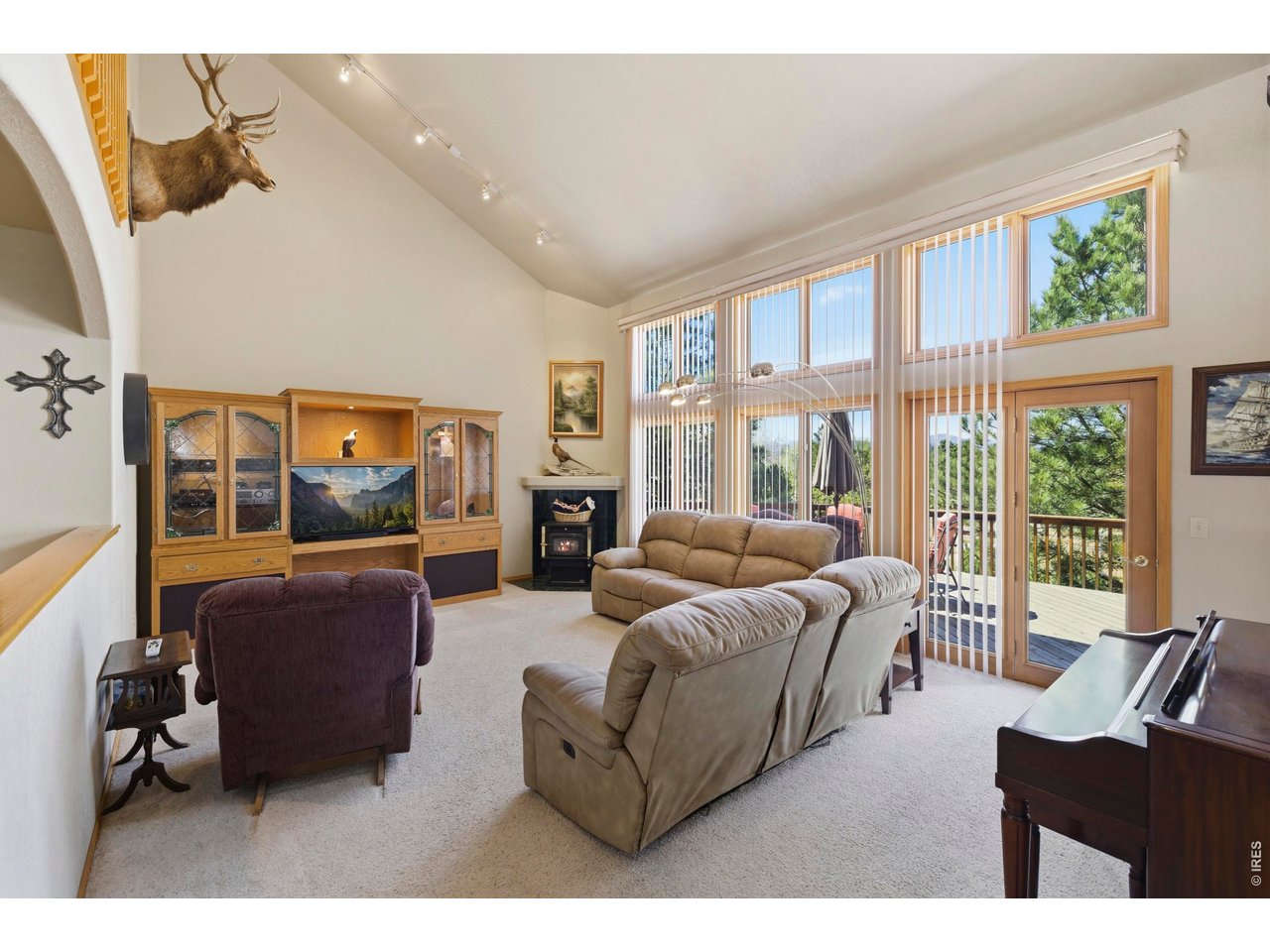 Stunning Custom Home offering 4,124 sq. ft. of beautifully designed living space, complete with a heated 24x36 Detached Shop & 3-car Insulated Garage WITH SPECTACULAR MOUNTAIN VIEWS! Built by BC Custom Homes. Lovingly maintained by the original owner, this property showcases quality craftsmanship & pride of ownership throughout. Step inside to soaring 10'-12' ceilings, a dramatic 17' living room, & floor-to-ceiling windows that flood the home with natural light. The grand entry features a sweeping staircase leading to a unique bridge-style upper level, creating a striking architectural focal point. The spacious Kitchen & Dining area offer expansive west-facing windows, Built-In Jenn Air Cook Top, full-length Breakfast Bar, Walk-in Pantry, & Schroll Custom Cabinets. The main floor also includes a versatile Office with Bay Window & closet (ideal as 4th Bedroom), plus a convenient guest bath. Upstairs, the Vaulted Primary Suite offers 10x12 Spa Like Retreat with a Soaking Tub, Separate Shower, & 12X6 Walk-in Closet. Additional bedrooms are oversized with ample storage, Large Closets & shared Full Bath. Finished Basement features tall ceilings, 30X37 REC ROOM, Built-IN Wet Bar with Sink, Refrigerator, & Microwave-perfect for entertaining-along with abundant Storage, a 12X17 HOBBY ROOM , including a large 1/2 bath ready for a future steam shower. Recent updates include Brand New Class 4 Roof, newer Furnace (2 years), Exterior Paint (3 years), Central Air, Sprinkler System. Outdoor living shines with large Double Deck, private shaded Veranda, Tiered Flower Beds, nearly full fencing, and 30x10 Dog Run. Additional highlights include a Gas Line for grilling, powered Walkway Lighting, Electricity Post at the circular driveway. Located in a well-maintained community with newly improved roads, HOA services covering trash, snow removal, & seasonal clean-up, plus school bus access through the neighborhood, located on an exceptionally gorgeous setting!