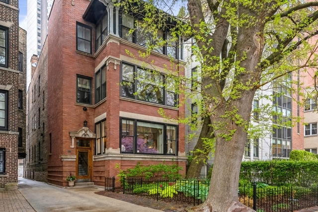 5 bedroom/3 bath duplex down (3000sf) that lives like a single family home in prime East Lakeview location. Enjoy the sun-light living room and adjacent sun room with oversized south facing windows overlooking tree lined Roscoe. 11 foot ceilings and hardwood floors through out the main floor.  A spacious formal living room with built-in book cases and gas fireplace. Formal dining room ideal for entertaining. Large kitchen with stainless steel appliances, granite countertops and a built-in breakfast bar. The primary suite features a walk-in closet with built-ins, updated bath and steam shower. There are also, 3 additional bedrooms on the main floor. Full finished lower level with large family room and bedroom, perfect for an in-law or nanny suite with kitchenette, full bath and additional storage.  1/2 block east to the lakefront and 1/2 block west to everything Broadway has to offer. Private garage parking and shared common patio.