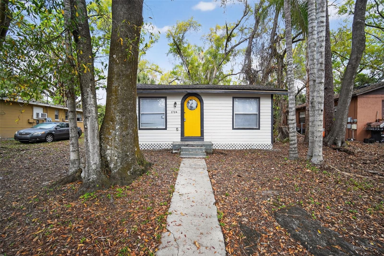 One or more photo(s) has been virtually staged. Welcome to this beautifully updated home in a prime Tampa location just steps from the Hillsborough River. Situated directly across from the river and a short walk to a nearby park, this property offers a rare combination of modern upgrades and outdoor lifestyle. The home features a brand new roof (2026) along with new luxury vinyl plank flooring throughout and new baseboards, creating a clean and cohesive interior. The entire home has been freshly painted inside and out, giving it a bright, move-in-ready feel. The fully renovated kitchen showcases shaker-style cabinetry, quartz countertops, stainless steel appliances, and updated hardware and fixtures, blending style and functionality. Both bathrooms have been updated to match the home's modern aesthetic. With its thoughtful upgrades, fresh finishes, and proximity to the river and nearby park, this home offers a great opportunity to enjoy comfortable living in a desirable Tampa location.