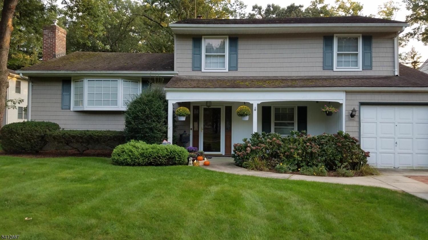Step into this beautifully maintained split level home located on the best spot on a quiet cup-de-sac and you'll want it for your own. The roomy covered front porch and expansive entry foyer are the perfect way to welcome guests. Inside, you'll quickly notice the warmth of hardwood floors, the charm of crown moldings and chair rails, and the sleek look of built in appliances. The  pergola covered patio and large backyard is the place for your outdoor fun. Come see for yourself ll this home has to offer, including beautiful perennial beds filled with blooming hydrangeas come spring. Walkable to shopping, houses of worship, NYC bus, schools, and the center of all town activities and events.
