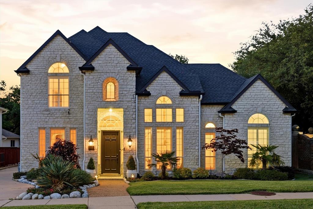 Welcome to an exceptional custom residence nestled in the highly sought-after Hills of Prestonwood in Plano, located within the hospital district. Backing to a tree-lined creek, this home offers a rare blend of privacy, natural beauty, and refined outdoor living, and has never lost power during the Texas freezes—adding valuable peace of mind.Designed for both relaxation and entertaining, the private courtyard showcases a sparkling chlorine pool and relaxing spa—perfect for soaking up the Texas sun or unwinding in the evenings—alongside a dedicated putting green where you can enjoy casual practice or host guests in style. Surrounded by lush greenery, this outdoor retreat feels like your own personal resort.Step inside to discover elegant travertine flooring flowing throughout much of the first floor, setting the tone for timeless sophistication. The home also features classic farmhouse shutters that add warmth and charm throughout. Three spacious living areas include a breathtaking main living room with soaring 20-foot ceilings and a dramatic wall of windows that flood the space with natural light and offer stunning views of the pool, spa, and courtyard.The thoughtfully designed layout also includes two dining areas, four generously sized bedrooms, and three full baths. The expansive kitchen is a chef’s delight, complete with granite countertops, ample cabinetry, and seamless access to a stylish wet bar—ideal for entertaining.An oversized garage with sleek epoxy flooring provides both durability and space, easily accommodating larger vehicles or additional storage needs.Ideally located just around the corner from The Clubs of Prestonwood – The Hills, a private championship golf course, this home offers an unmatched lifestyle in one of Plano’s premier neighborhoods—combining luxury, comfort, and value. Schedule your private tour today before this exceptional home is gone.