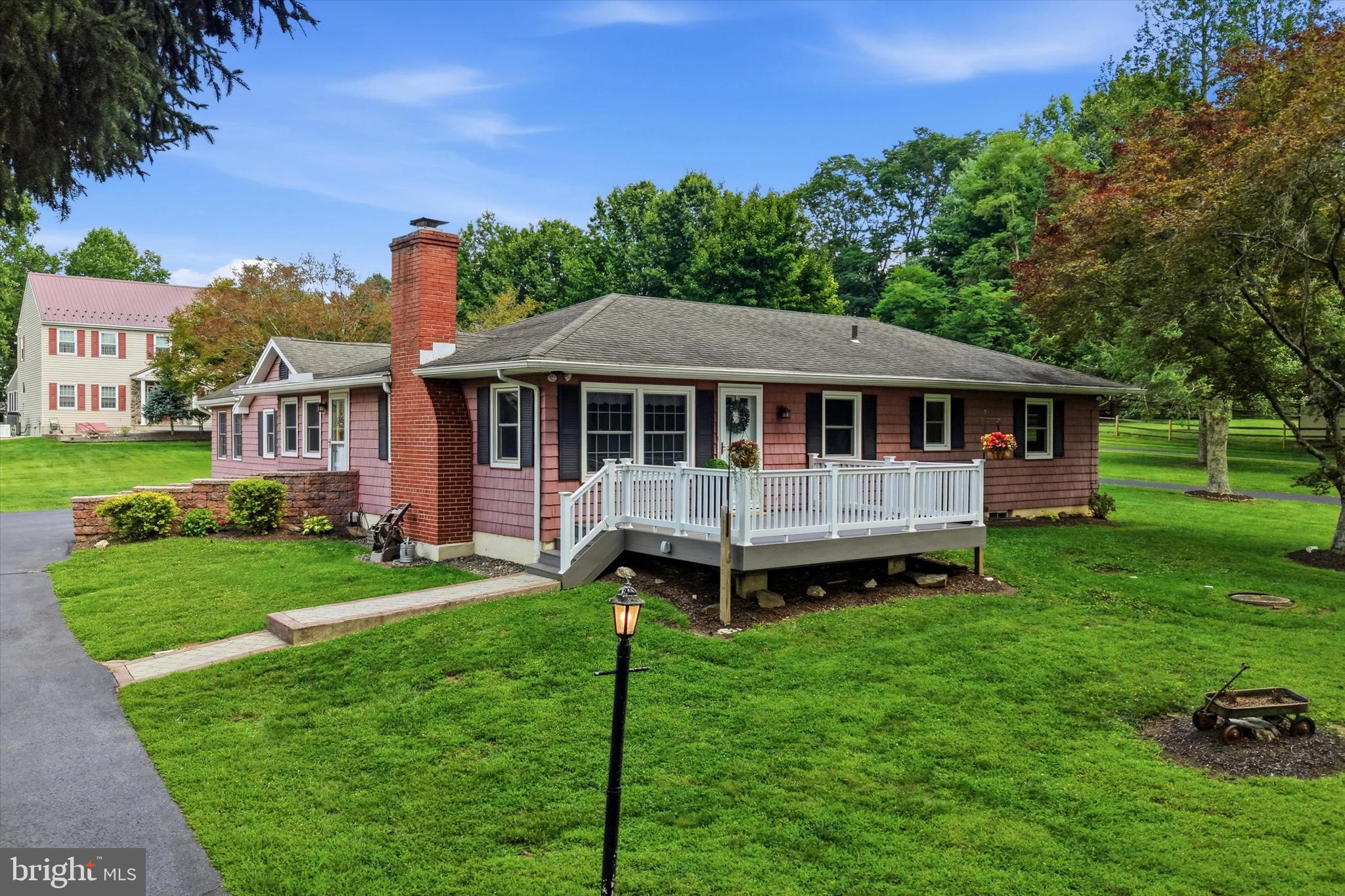 Welcome to 331 Valley Road, an expansive ranch home offering exceptional versatility and exciting possibilities for multi-generational living, an in-law suite, a private primary retreat or extra living space. Follow the light-lined driveway to the welcoming, low-maintenance Trex deck and front entrance. Inside, the spacious living room features original hardwood floors and a cozy brick fireplace. The main kitchen offers abundant cabinetry, Corian countertops, a pantry cabinet, island seating for two, and a bright breakfast area. A formal dining room just off the kitchen provides the perfect setting for gatherings and entertaining. The front portion of the home includes three generously sized bedrooms and a full hall bathroom. Beyond the breakfast area, you’ll find an impressive additional living space with its own private entrance. This flexible suite features an oversized living room with a wood-burning stove, a kitchen, a spacious bedroom, a den, and a full bathroom with a stall shower, ideal for extended living arrangements, guests, or a luxurious primary suite. Step outside to the cozy rear patio, the perfect place to enjoy your morning coffee while overlooking the flat backyard. A convenient side entrance is enhanced by a stunning paver walkway leading to the driveway. A dual-access coat closet, accessible from both the hallway and living room, adds everyday functionality. The basement offers even more space, featuring a full wet bar, a second brick fireplace, a laundry area, and an unfinished section ideal for storage, a workshop, or future possibilities. Bilco doors provide exterior access. Car enthusiasts, hobbyists, and anyone seeking additional storage will appreciate the impressive detached garage, which can accommodate up to 4 vehicles and features electricity, epoxy floors, and attic storage. Additional highlights include a generator and flat front and rear yards that enhance the home’s curb appeal and outdoor enjoyment. ROSE TREE MEDIA SCHOOL DISTRICT. Ideally situated near Sleighton Park, Edgmont Township Park, Tyler Arboretum, and Ridley Creek State Park, this location offers endless opportunities for hiking, biking, and year-round recreation. Enjoy local favorites such as La Porta, Country Deli, and Grace Winery, along with the charming shops, restaurants, and community events in the Borough of Media. Granite Run Promenade, The Shoppes at Brinton Lake, Wedgewood Gardens, Arasapha Farm, and several renowned golf courses are also nearby. Commuters will appreciate convenient access to Routes 352 and 1, West Chester Pike, and the Wawa Train Station. 331 Valley Rd offers peaceful surroundings, remarkable flexibility, and suburban convenience. This exceptional property is ready for its next chapter. Schedule your private showing today. Home is where your story begins!