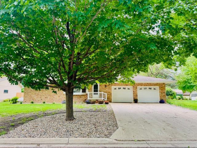 Step inside this well-cared-for ranch-style home with a sought after location featuring 1,640 sq. ft. of main-level living space and an attached double garage. The main floor offers two generously sized bedrooms, a formal dining room, a comfortable living room with a gas fireplace, and a spacious laundry room designed for convenience. Enjoy year-round comfort in the all-season sunroom, which opens onto a maintenance-free deck—perfect for entertaining or relaxing—overlooking a spacious backyard. The exterior boasts low-maintenance brick and steel siding for lasting durability and curb appeal. The fully finished lower level adds even more flexibility with an additional bedroom, bath, a cozy family room, and a bonus area that’s ideal for a home gym, office, or creative space. This home blends space, comfort, and function—ready for you to make it your own.