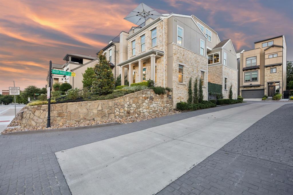 Discover the perfect balance of sophisticated design and effortless modern living. This gorgeous home is situated on a coveted corner lot in Kessler Park. This expansive 2,714-square-foot contemporary home is ideal for those seeking more space without the burden of heavy maintenance. Combining the security of a lock-and-leave lifestyle with premium upscale finishes, this residence offers a rare opportunity to capture a turnkey home in a highly connected urban setting.Step inside to an atmosphere of refined luxury, where 11-foot ceilings and wide-plank hardwood floors are complemented by professional interior curation. The home boasts standout custom upgrades, including designer wallpapers by Cole & Son and Thibaut, high-end Foscarini lighting, automated shades, and integrated audio. Designed with an entertaining lifestyle in mind, the open-concept layout centers around a chef’s kitchen featuring ceiling-height cabinetry, extensive storage, and seamless flow into the living and dining areas. With three generously sized bedrooms, two full bathrooms, and two half-bath powder rooms, the floor plan maximizes comfort, privacy, and everyday functionality. The crown jewel of this property is the spectacular third-floor rooftop deck, offering breathtaking, unobstructed views of the downtown Dallas skyline, perfect for evening relaxation or impressive hosting. Located near the historic Stevens Park Golf Course and just minutes from the vibrant dining, boutique shopping, and culture of the Bishop Arts District, this location offers an unparalleled lifestyle. Commuters will appreciate the incredibly close proximity to downtown Dallas and major transit routes like I-30, making the daily drive effortless.