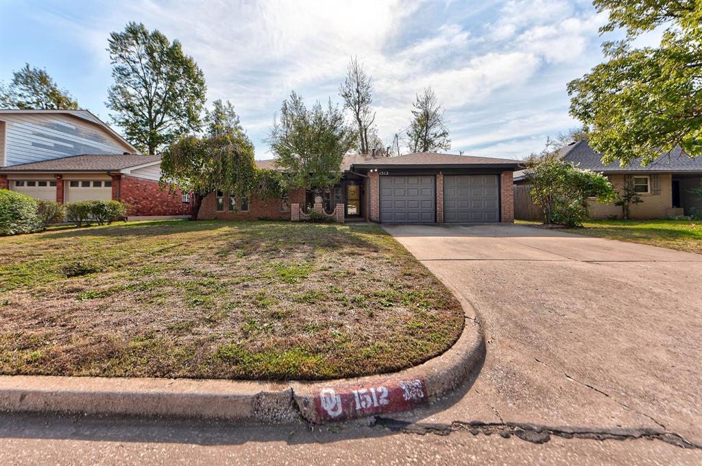 Welcome home to 1512 Charles Street, a beautifully refreshed brick ranch tucked into an established neighborhood in the heart of Norman! Step inside and the vaulted living room steals the show, with a striking brick fireplace framed by built-in shelving and plenty of natural light. New wood-look flooring flows through the main living areas, and fresh paint gives every room a crisp, move-in-ready feel. The kitchen shines with brand-new Formica countertops and a stylish new backsplash, a cooktop, and a built-in oven, and with two dining spaces there is always room to gather. All three bedrooms feature plush new carpet, the primary bedroom has its own private bath with a tiled shower, and the hall bath has been fully updated from top to bottom. Peace of mind comes standard, too: the foundation was professionally repaired with piers in 2026. Outside, enjoy morning coffee on the covered front porch, then head out back to a large covered patio overlooking a fully fenced yard with a handy storage shed, ready for cookouts and lazy weekend afternoons. With a two-car garage and an easy drive to the University of Oklahoma, downtown Norman, shopping, and dining, this one checks every box. Schedule your private tour today before it's gone!