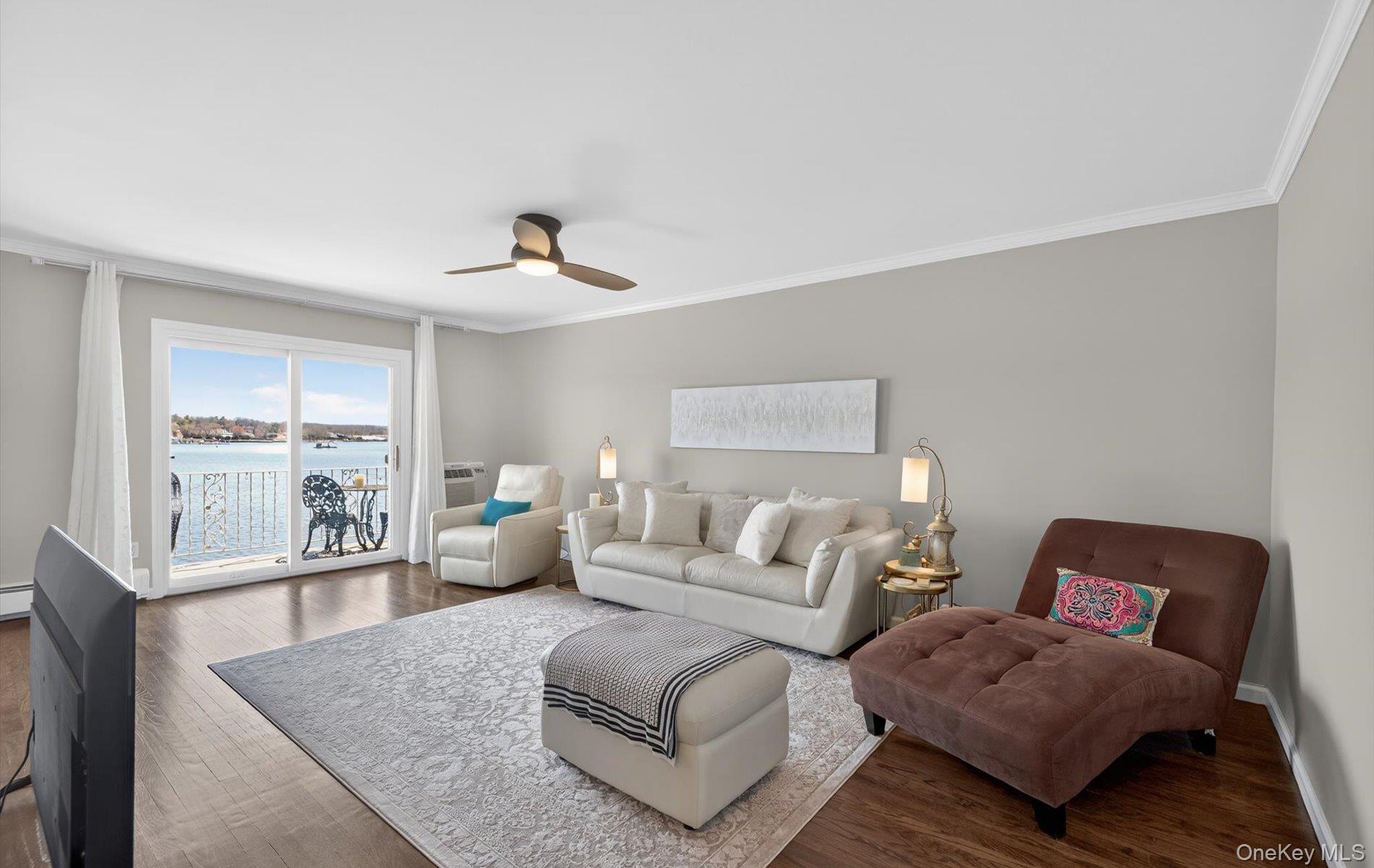 From the moment you walk in, you feel like you’re on vacation—and may never want to leave. This is a rare opportunity to own a beautifully updated 1-bedroom, 1-bath waterfront residence at Toms Point—the first 1BR waterfront unit available in 4 years! Perched on the second floor, this spacious apartment features a private terrace with breathtaking, direct views of Manhasset Bay and the Port Washington shoreline.The home has a sleek, modern feel throughout. The renovated chef’s kitchen features quartz countertops, white cabinetry, new grey flooring, and stainless steel appliances including Bosch and Liebherr, along with a ceramic backsplash and recessed lighting. The living space is bright and open, with dark hardwood floors, crown molding, and a layout that maximizes light and views.The bedroom offers a custom-designed closet and window treatments, and the bathroom is finished in ceramic tile. Additional highlights include abundant storage, Minka ceiling fans, and move-in ready excellent condition throughout.Residents enjoy exceptional waterfront amenities, including a gunite pool overlooking Manhasset Bay, private beach access, kayak storage, mooring rights, and a scenic bayfront promenade. The community also features landscaped grounds, a library, bike and storage rooms, and a daily gate attendant for added piece of mind. Ideally located near the LIRR (approximately 36 minutes to Manhattan), as well as shopping, dining, and all that Port Washington has to offer. New insulated roof installed in 2024. A rare, turnkey waterfront home offering an exceptional lifestyle and truly spectacular views.