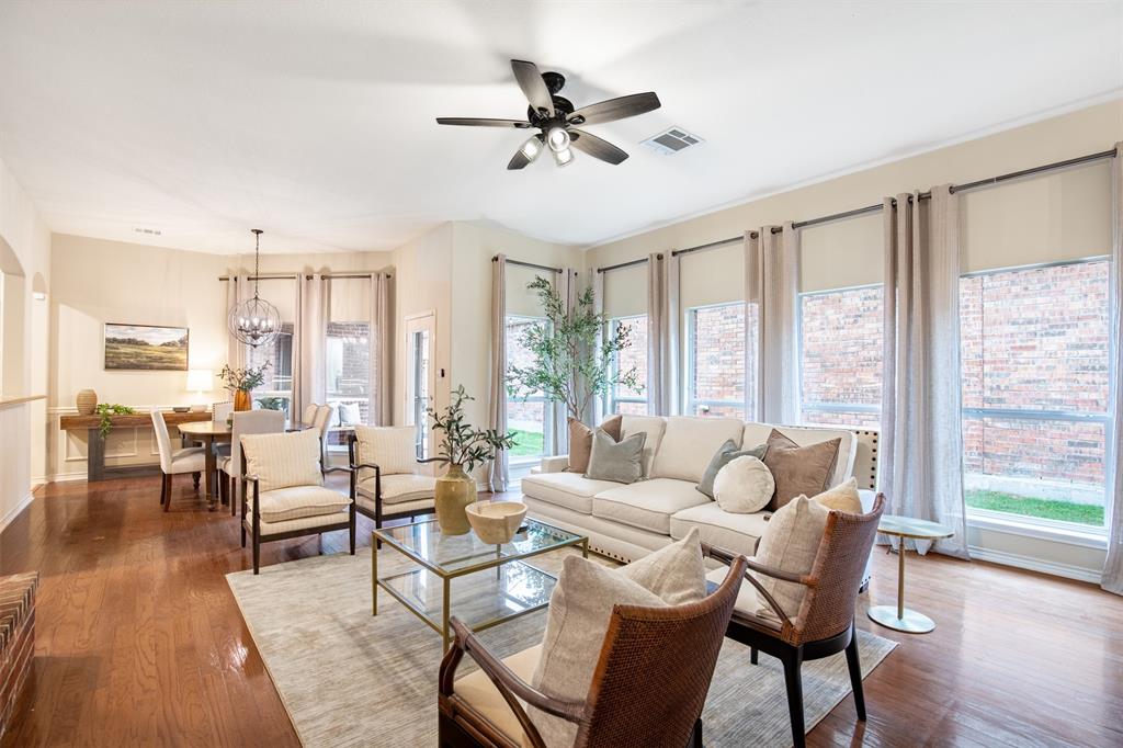 LOVE WHERE YOU LIVE. This Queen’s Gate gem at 9458 Park Garden Drive is a masterclass in sophisticated, low-maintenance living in Frisco—recently named the #1 Best City for Working from Home and the Most Affordable Fastest-Growing City for 2026. This zero-lot-line garden home trades a traditional yard for high-end interior style and private outdoor serenity. Inside, the vibe is airy and polished, featuring soaring ceilings, a gas log fireplace, and no carpet throughout—just warm wood floors in the main areas, while one bedroom, the kitchen, and the laundry room feature sleek ceramic tile floors. The kitchen is an entertainer’s dream, anchored by a massive granite breakfast bar and a generous walk-in pantry. The location is exceptionally convenient for both work and play, situated just minutes from the upcoming Universal Kids Resort, the Rail District, and the world-class PGA Frisco campus. Perfectly positioned near the region's major corporate hubs. Minutes to The Star, home to the Dallas Cowboys, and nearby global giants like Toyota Motor North America, JP Morgan Chase, FedEx Office & Liberty Mutual. Other prominent companies in Frisco include T-Mobile, Keurig Dr Pepper, Oracle & McAfee. DFW International Airport & Dallas Love Field are accessible within 30 minutes. The real magic happens out back, where a perfectly scaled covered patio - glowing under the warm ambiance of bistro lights - opens to a private, fenced oasis. Directly across from your front door, you'll enjoy serene views of a quiet, tree-lined neighborhood park area. You are also just a short stroll from the larger Vivian Stark McCallum Park with playground & basketball and private community pool just down the street.  Zoned for Frisco ISD, which recently earned an A rating in state accountability reports. Recently appraised by Collin County at $467,103 - this home offers an incredible lifestyle and immediate value in one of the city's most desirable pockets. 3D tour.