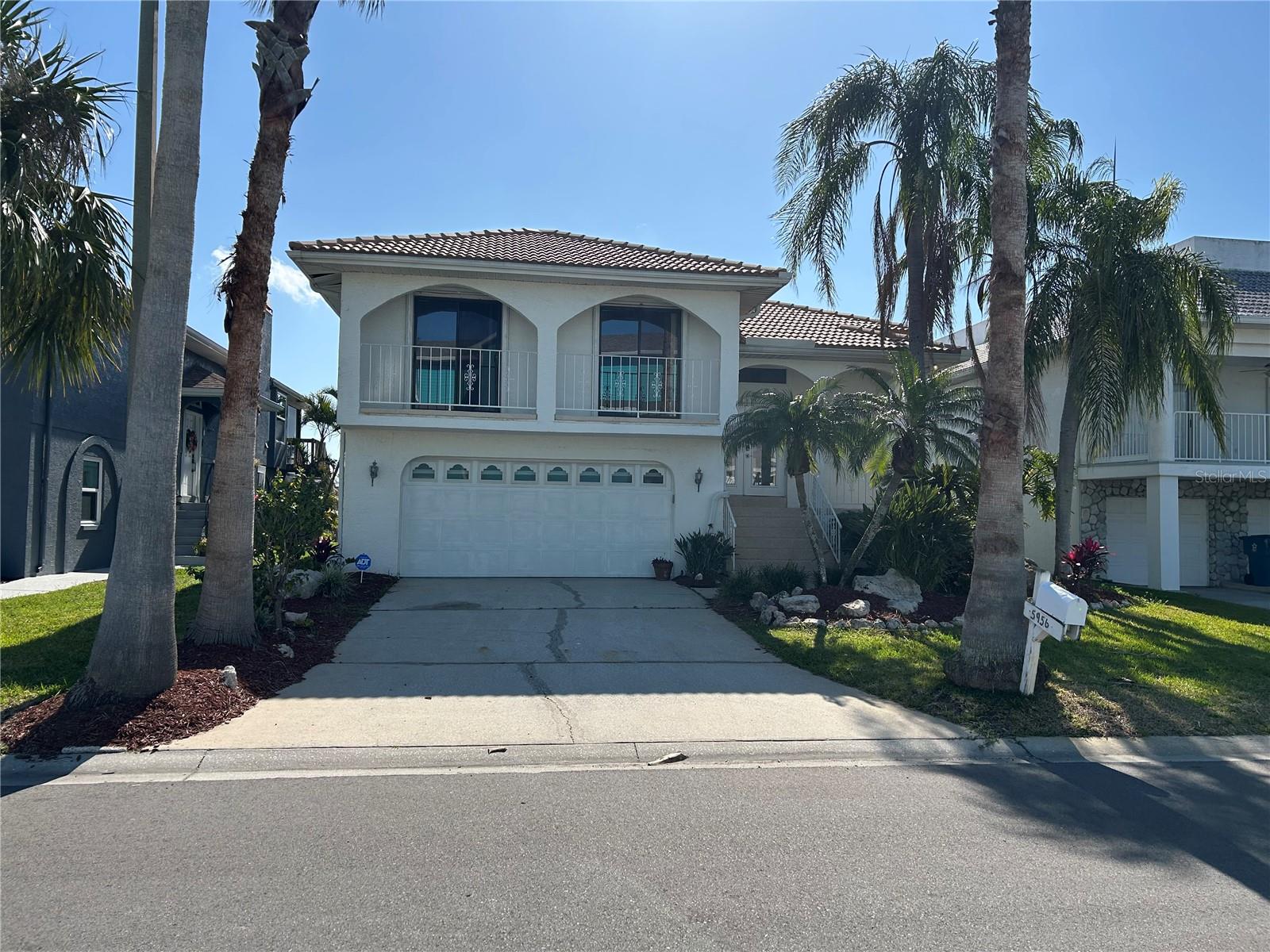 Spectacular location with this waterfront home in highly sought after community of Gulf Harbors/Sea Forest!!!  This home has exceptional curb appeal with a tile roof, lush landscaping, and muted exterior colors.  A sparkling private pool and patio/deck area overlooks the saltwater canal with seawall, dock and boat lift with direct access to the Gulf allowing you to bring that boat you have been dreaming about!!!  This property has balconies in the front and rear of the home showcasing glorious morning sunrises and evening sunsets.  As you enter this property from the leaded glass double doors, you are greeted with tons of natural light and an open, expansive living/dining/and kitchen area with stunning views from every angle plus a cozy corner fireplace for those cooler evenings with loved ones.  The enlarged kitchen is pure class personified with super high-end wood cabinets and granite counters, upgraded backsplash, and stainless-steel appliances.  The main floor also includes a large primary bedroom and two oversized secondary bedrooms, laundry room, and to completely remodeled, spa quality bathrooms!!!  The lower level and additional heated and air-conditioned square footage consist of a 19'x28' party room with a huge bar overlooking the outside pool deck and waterway.  Also located on the lower level is another bedroom, multiple storage closets, a workshop and 2 car garage.  This community has many features and activities like tennis and pickleball courts, clubhouse, spa, and swimming pool.  For an additional $200 a year, you can be a member at the Gulf Harbors Beach Club and enjoy your own private beach on the Gulf.  This home is waiting to be your FLORIDA WATERFRONT PARADISE!!!