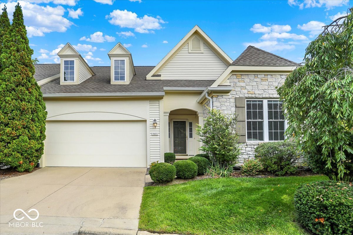 This exquisite property boasts luxury and functionality at every turn. Situated on a serene .23-acre lot with a picturesque tree-lined backyard, this meticulously crafted residence offers unparalleled comfort and style. Stunning architectural details throughout this beautiful home include 9-foot ceilings, crown molding, coffered ceiling, and arches. As you walk through the home, experience the elegance of distressed cherry wide plank flooring and porcelain tile floors, complemented by solid core doors. The heart of the home is the stunning gourmet kitchen, where custom Mouser maple painted cabinetry, granite countertops, weathered, hammered copper farm and prep sinks, and antique bronze hardware create an atmosphere of timeless elegance. Whip up culinary delights with ease using the Wolf 6-burner gas cooktop and built-in double ovens, integrated dishwasher, and a Sub-Zero refrigerator. The large kitchen island is complete with a teak countertop, prep sink, and beverage fridge. The kitchen is open to the casual dining area/sunroom, surrounded by windows and offering views of the lush backyard and access to the deck. The spacious living room features a gas fireplace with a marble surround and natural light. The home has two primary suites: one on the main level and the 2nd one taking up the entire upper level. Each suite includes custom California-style closets and air jet tubs in its respective full baths. Both offer nice privacy. The main level also provides an office with a stunning coffered ceiling and a guest bedroom, a full bath, and a laundry room complete with a washer & dryer, storage, and a utility sink. The walkout lower level is an entertainer's paradise, complete with a wet bar, kitchenette, game room, large family room, media room, workshop, 4th bedroom, storage, and full bath. Access from the lower walkout to the covered patio provides the perfect spot for outdoor gatherings, while the Trex deck off the main level offers space for al fresco dining or si