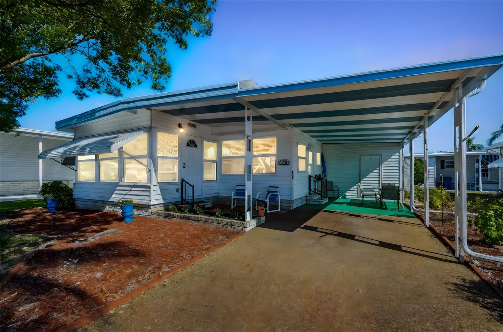 Cozy Beach-Cottage Vibes in Fairway Village — Where the Living Is Easy and the HOA Fees Are Low.Welcome to your new happy place! This charming home shows off its white bead board walls and abundance of natural light, giving it a breezy beach-cottage feel.  Whether you are on vacation or living here year-round, you will be able to RELAX, knowing you never have to mow the lawn or shovel the snow! Per the Sellers, this home has a newer vapor barrier, brand-new venting for the A/C, newer windows, luxury vinyl plank flooring, and a sound roof, giving you peace of mind that the important components are done.   The bright kitchen is well-equipped, and has a dining area that flows into the spacious living room.  For extra space when you entertain, just throw open the doors to the Florida Room for an extra 130 square feet.Nestled in the highly desirable Fairway Village 55+ community, you’ll have access to all the resort-style fun you want.  In addition to 2 pools (with heaters and chillers) and spas, you will find a fairly new clubhouse which houses a fitness center, pool tables, poker room, library, art room, meeting rooms, large commercial kitchen, and a banquet hall with a state-of-the-art A/V booth.  There is also an enclosed shuffleboard court for unleashing your competitive spirit, and a private 9-hole golf course for perfecting that swing.  Sidewalks are located throughout the entire village for taking long walks and enjoying the lovely ponds and beautiful  landscaping.  With all the activities, groups and sports leagues, you can be as active as you wish!  This vibrant community has many events year-round, including concerts, dances, karaoke, lip sync shows, Golf Cart Parade, Halloween costume party, and Summer Olympics.  Best of all—low HOA fees!This home is furnished and turn-key ready.  All you need is your suitcase and a toothbrush.  If you’ve been dreaming of easy living in sunny Florida, this home is ready to hand you the keys… and maybe a shuffleboard cue.