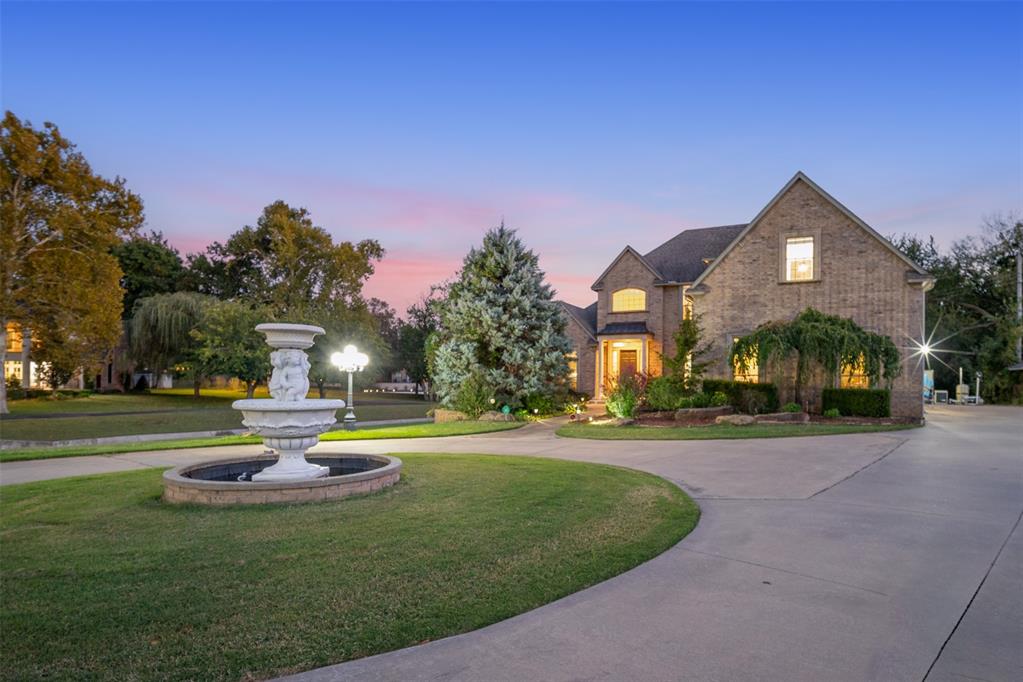 6 BLOCKS FROM OU CAMPUS--1.14 ACRE LOT LOCATED ON GREENBELT LOT WITH WALKING PATHS--STUNNING, HEATED POOL & SPA WITH PREMIUM PEBBLE-TECH FINISH & WATERFALL FEATURE-- PRIVATE, GATED ENTRY WITH CIRCLE DRIVE & ENTRY FOUNTAIN.  $200k+ worth of upgrade installed since 2021. Relax aside the pool or on second floor balcony through customized spiral staircase and enjoy an unspoiled view of walking paths and a beautiful Greenbelt view. Relax on the shaded wood deck while the family swims and serve dinner on the large backyard deck. Enjoy walking paths into the adjoining neighborhood featuring a fountain and a pond. Extensive, oak wood flooring in the home and new carpet throughout. Primary suite downstairs with large, bright bathroom and underfloor heating. The upper-level features four bedrooms, each offering unique amenities. One bedroom has access to balcony, with a spiral staircase leading to the pool, making it a perfect guest pool room. One bedroom includes ensuite bath. Other two bedrooms share a jack-and-jill bath, with one room showcasing a generously sized closet. The thoughtfully designed spaces provide comfort and privacy. Large executive-sized study with new wood flooring, a wall of built-ins, and floor-to-ceiling windows for gorgeous views to front yard and crimson-cream brick bridge leading to ou campus. Spacious kitchen with 6 burner cooking center with griddle, a large walk-in pantry and large kitchen island. Main floor has a formal living room and a casual family room, each with a fireplace. Other features include water well for lawn irrigation, a "secret room" that your kids will love. Main upgrades since 2021 include newly installed inground pool/spa, entry gate and three sections of fence, customized spiral staircase, 2 new HVACs, new front yard fountain, new carpet, partial hardwood floor, newly built-in electric fireplace, storm shelter, comprehensive security systems covering all entry points, and termite bond (2024). Top rated McKinley elementary.