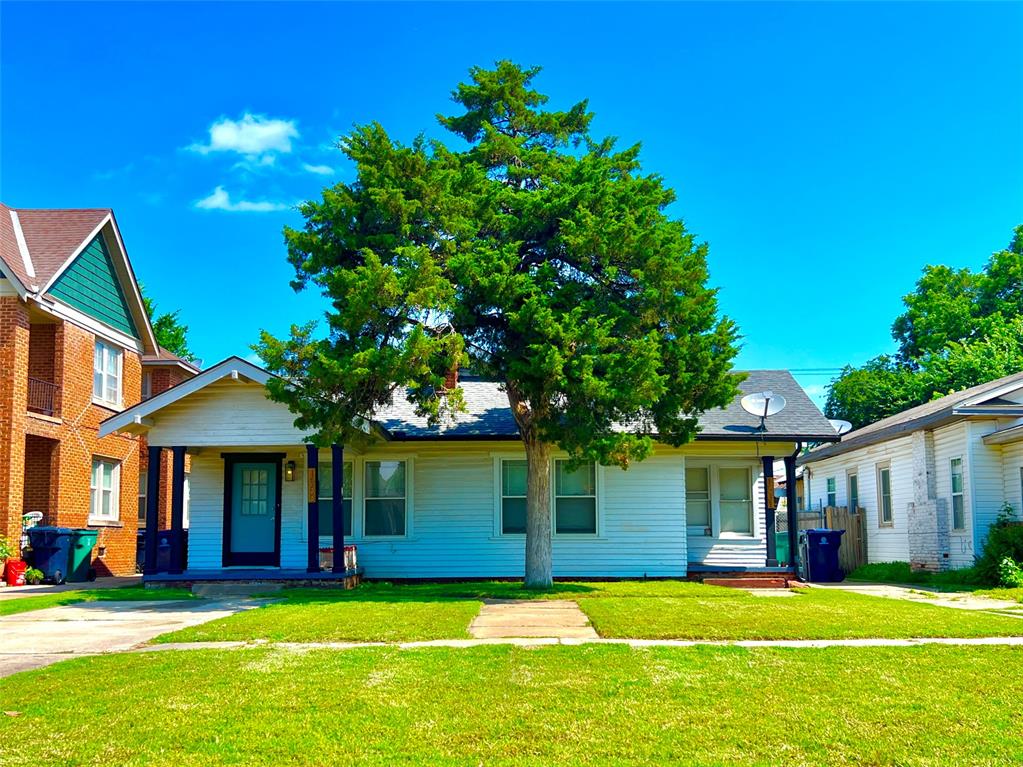 This fully leased duplex offers a beautifully balanced blend of historic charm and modern updates, creating a turnkey investment opportunity in the heart of Oklahoma City. Located just steps from Oklahoma City University and minutes from Uptown 23rd, Paseo Arts District, Midtown and the Asian District.  Each unit features a functional floor plan with 1 bedroom, 1 bathroom, a bonus room, and updated kitchen and bath. Interiors showcase hardwood floors, white paint, ceiling fans, high ceilings, large closets, and original woodwork that adds timeless character. A mock fireplace serves as a stylish focal point in the living space. The property has been thoughtfully renovated with energy-saving heating and cooling systems, new electrical panels, updated appliances, and modern lighting throughout. Both units include private porches, inside laundry, and access to a fenced-in backyard. Generating $1,990 in monthly income and designed for low maintenance, this property is a solid addition to any portfolio, offering immediate returns and long-term value in one of OKC’s most vibrant urban corridors.
