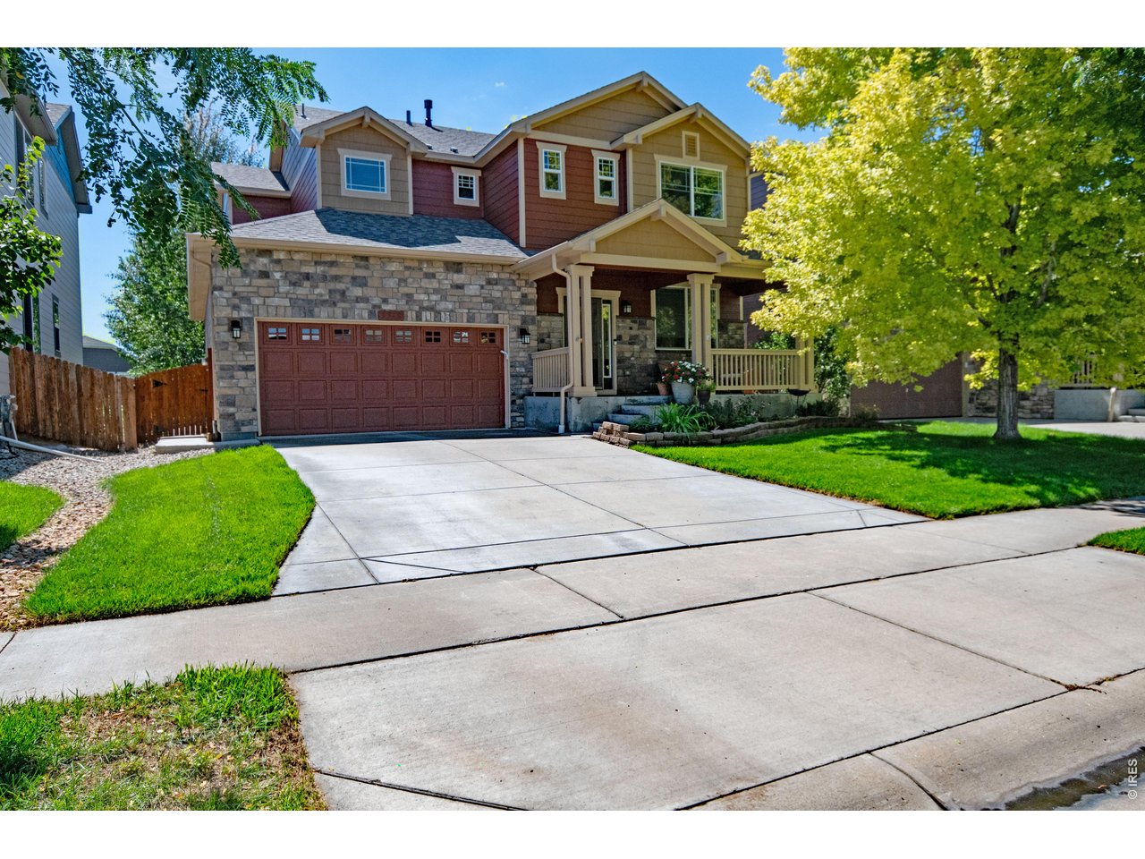 Welcome to this lovingly maintained, one-owner, 2-story home offering 3 bedrooms, 3 baths, and wonderful indoor-outdoor living on a spacious, tree-filled lot. The light and bright living area features soaring ceilings extending to the roofline, creating an open, airy feel, while a balcony overlook adds distinctive architectural character. The generous kitchen is designed for everyday living and entertaining, featuring a large granite island, tile backsplash, breakfast nook, upgraded drawer shelving, and newer Frigidaire/Electrolux appliances, including an induction range, microwave, and refrigerator. A dedicated laundry room is conveniently located just off the kitchen. Enjoy the covered front porch or relax in the private backyard on the large deck with privacy screens. Mature trees and established perennials create a peaceful setting, while a concrete sidewalk provides convenient access from the driveway to the backyard. An Andersen self-storing screen/storm door and Ring doorbell camera add thoughtful touches of convenience. Additional features include ceiling fans in the living room and bedrooms, a 2-car garage with EV charging plug-in, fresh exterior paint, and a new A/C unit installed spring 2026. The unfinished basement offers excellent potential for future expansion, storage, or a personalized space. Ideally located just minutes from I-25 and Old Town, this home offers a wonderful combination of space, character, convenience, and established outdoor living. HOA fees include irrigation water for the yard, trash, and recycling.