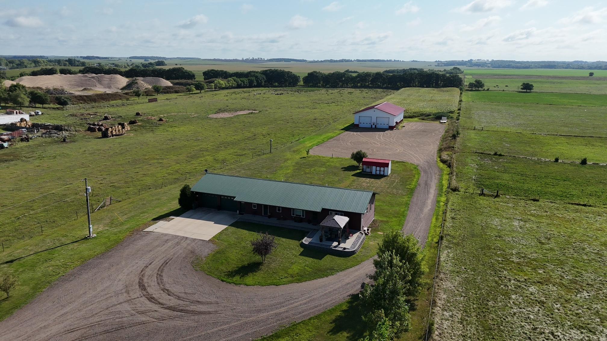 Built in 2008 here is a 3 bed 3 1/2 bath 3500+ sq ft rambler style home w/two stall heated garage on 5 acres just north of Little Sauk! Property features: 2020 built 50x80 shop, Maintenance free siding, Steel roof, Front porch with Pergula, back deck, large entryway & kitchen & great open floor plan!