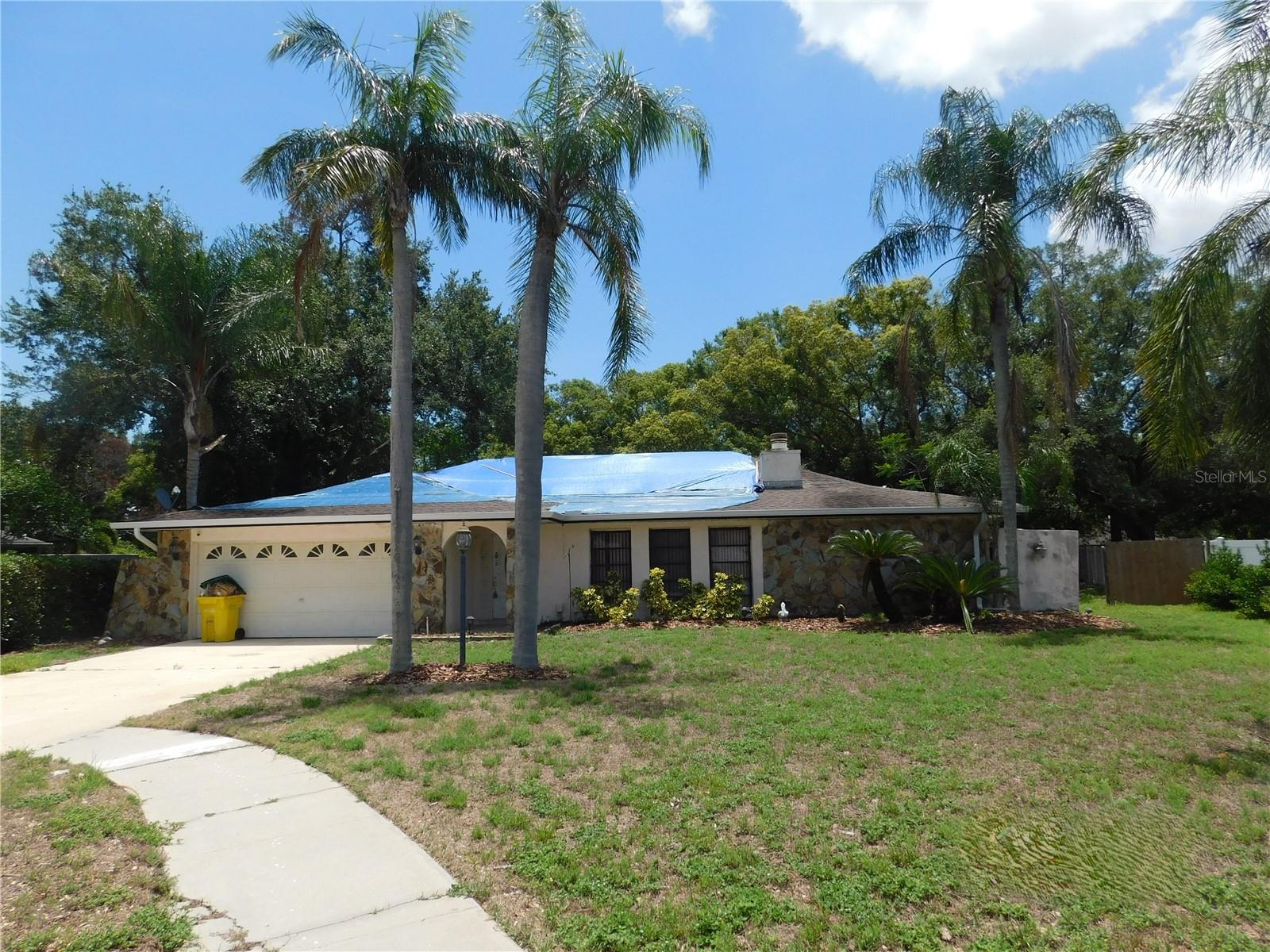 Auction Property. Large cul de sac lot in beautiful Westlake Village.  With a split floor plan of over 2200 sq feet, you will find more than enough room. Westlake Village offers one of the largest parks in northern Pinellas. There are 4 tennis courts, a walking path of nearly 1 mile in length, swimming pool, and much more available!!  This property is now under auction terms. All Bids must be submitted during the auction via the property's listing page. This sale is subject to a 5% or $2,500 minimum buyer's premium pursuant to the auction Terms & Conditions. All bids will be subject to seller approval (minimums may apply). Under FinCEN's new RRE Rule, transfers will be subject to reporting when buyers use entities or trusts to take title to residential real estate, when the transaction is all cash, privately financed or HELOC. Purchasers may use any lender they choose to finance the purchase of the property, however, Seller requires that all non-cash offers be pre-qualified by NewRez prior to negotiation of the offer.