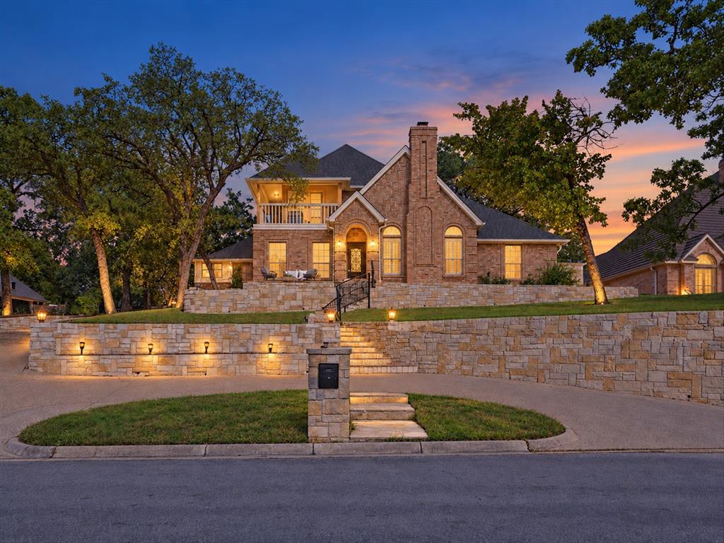 Completely renovated and designed for entertaining, this spacious home in Colleyville’s Woodbriar Estates West offers an incredible curb appeal sitting on a hill, circular driveway and side-entry 3-car garage, while new engineered hardwood flooring, fresh interior paint, new interior doors and upgraded hardware bring a cohesive feel throughout. The completely remodeled kitchen features new cabinetry, Taj Mahal countertops, a new induction range and a new vent hood. An adjoining butler’s pantry offers matching Taj Mahal countertops, additional storage and ample prep space, while a custom dry bar makes hosting effortless. The 1st-floor primary suite features a private fireplace, sitting area, custom closet and fully renovated bathroom with designer tile, a walk-in shower with dual shower heads, new vanities and a dedicated makeup vanity. A separate tankless water heater serves the primary bathroom. A second fireplace anchors the living room, while dedicated media and game rooms provide space for entertainment and recreation. Two full-size laundry rooms, one upstairs and one downstairs, offer everyday convenience, complemented by updated cabinetry and additional 3rd-floor storage space or office! Outdoor living shines with two balconies, mature trees, extensive stonework, a new front patio, a back covered patio and an outdoor kitchen with a built-in grill. A $35,000 hot tub, recently serviced and cleaned, completes the backyard! Beyond the finishes, practical improvements include updated plumbing in select areas, replaced HVAC ductwork throughout, updated lighting and recent servicing of all three HVAC systems. A home inspection was completed in June 2026, with all identified issues addressed as part of the renovation plus a ONE-YEAR TRANSFERRABLE WARRANTY on all renovation work with Olio Builders. Located directly on border of HEB ISD, making it an easy eligibility for the Grapevine-Colleyville ISD transfer subject to district requirements, availability and approval.