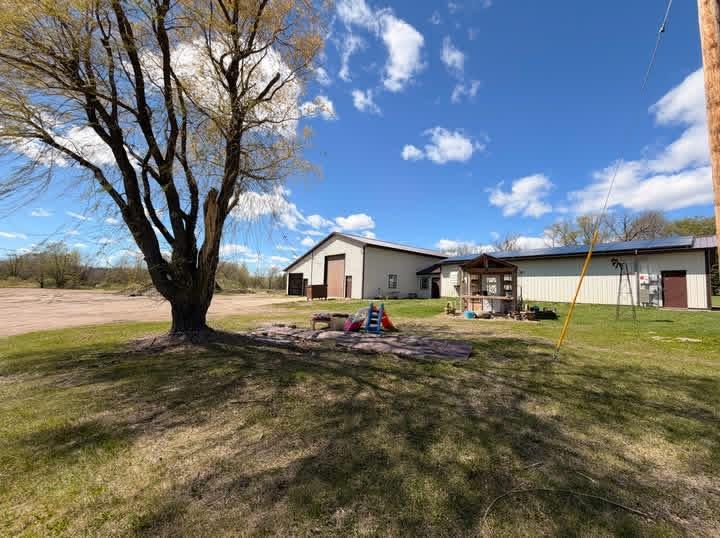 Looking for a property that’s anything but ordinary? This versatile 10-acre Little Falls property is packed with possibilities—whether you’re dreaming of a hobby farm, need serious garage and workshop space, want room for your business, or simply crave a little more land and freedom!The 3-bedroom, 1-bath home offers comfortable main-level living with a bright, spacious kitchen and open living area perfect for everyday life and gathering with family and friends. Upstairs provides additional flexible space, while a durable steel roof and septic system—both installed in 2019—add even more value.But the real showstopper here is the incredible garage and shop space! Whether you’re an auto or diesel enthusiast, contractor, business owner, RV owner, or someone who can never have enough room for projects, equipment, and toys, this property delivers. The shop features a heated office, professional paint sprayer, air compressors, floor drains, and an impressive 14-foot garage door capable of accommodating RVs and commercial vehicles. A variety of tools are also included with the sale, making this an exciting opportunity for someone ready to put the space to work.The attached 2-stall garage is heated as well, creating even more usable space year-round. A wood stove and supplemental propane heat provide multiple heating options, while solar panels add an energy-conscious feature to the property.Outside, you’ll have 10 sprawling acres to make your own—bring the animals, create your hobby farm, expand your business, store your equipment, plant gardens, or simply enjoy having room to breathe.This isn’t just a home—it’s a property built for big ideas, big toys, and big possibilities. If you’ve been searching for a place where you can live, work, create, and spread out all in one location, this one deserves a closer look!