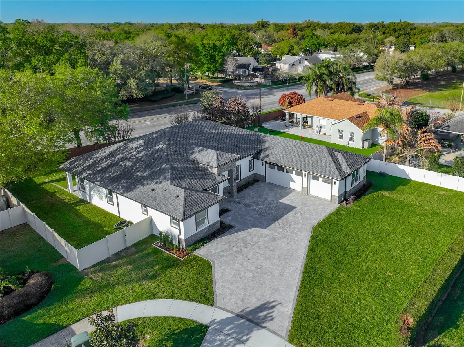 Under contract-accepting backup offers. WELCOME HOME! Beautiful 5-bedroom, 3.5-bathroom NEW CONSTRUCTION HOME with over 3,150 sq ft of living space and nearly 4,500 sq ft under roof, located on a quiet cul-de-sac in a great neighborhood. The layout is very functional and open, with a spacious great room that flows nicely into the dining area and the main kitchen, making it perfect for everyday living and entertaining. The kitchen offers a large island, plenty of cabinetry, and great prep space, plus the home also features a secondary prep kitchen/kitchenette, which is a great bonus for cooking, hosting, or extra convenience. The primary suite is spacious and private, and the additional four bedrooms provide plenty of flexibility for family, guests, or even a home office. Outside, you’ll find a large covered lanai that’s perfect for relaxing or enjoying time with family and friends. The property also includes a 3-car garage, mud room, and laundry room, and being located in a cul-de-sac adds extra privacy and minimal traffic. Overall, it’s a very comfortable and well-designed home in a location that’s hard to beat.Please note that the summer kitchen photo has been virtually staged and may vary, as it is currently under construction.